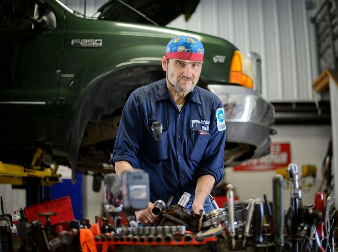 Tim Nelson worked in the Hastings auto repair shop he runs with his wife Kristi.