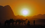 A searing sunset adds more magic to the lunar-like Wadi Rum desert.