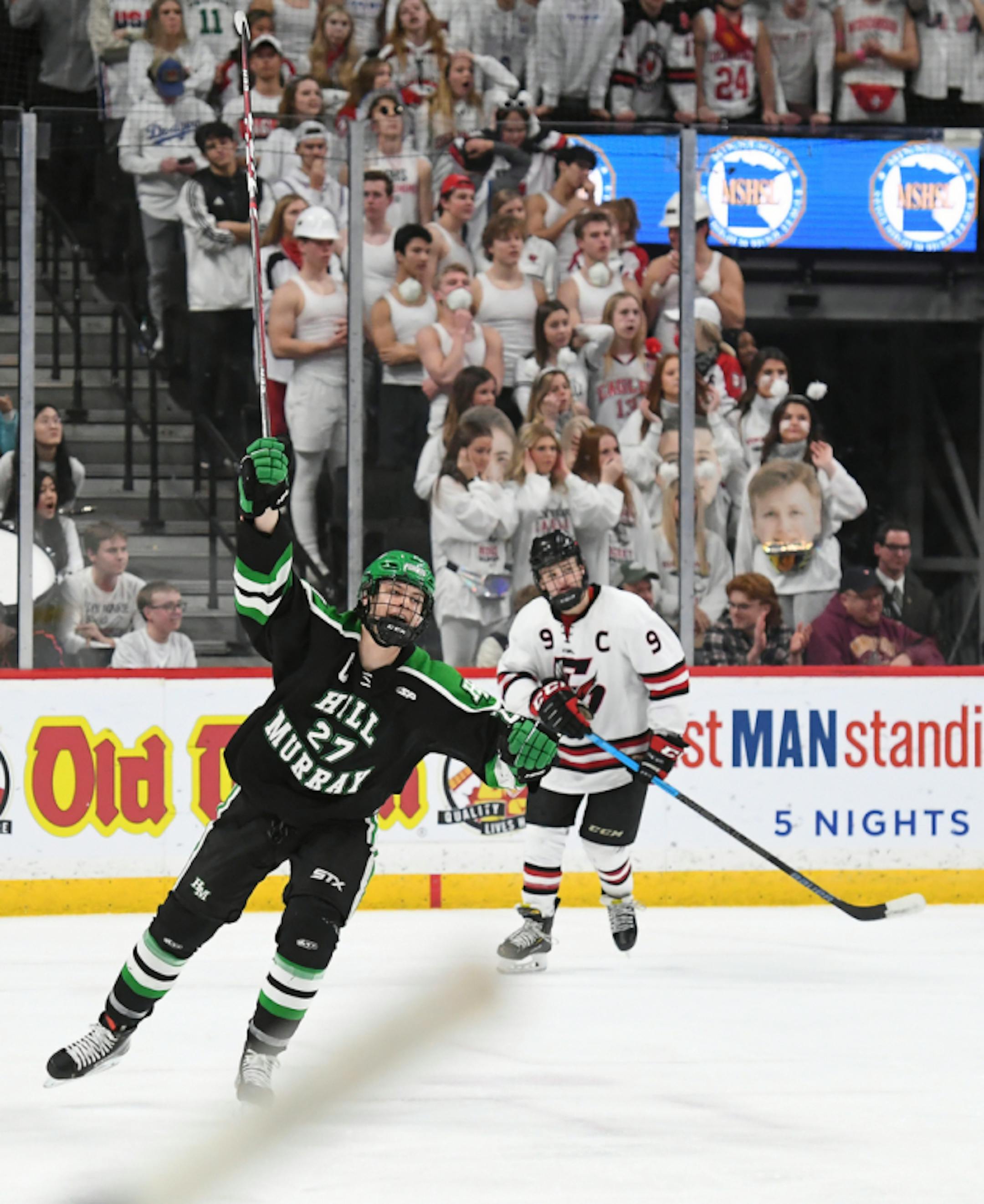 Hill-Murray forward Charlie Strobel (27) celebrated a first period goal by defenseman Matthew Fleischhacker (14).