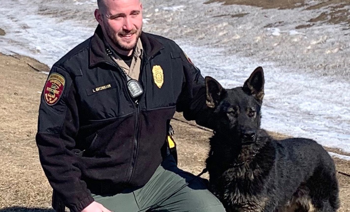 Minnesota Conservation Officer Luke Gutzeiller of Redwood Falls with Earl, the latest addition to the Enforcement Division's K9 unit.