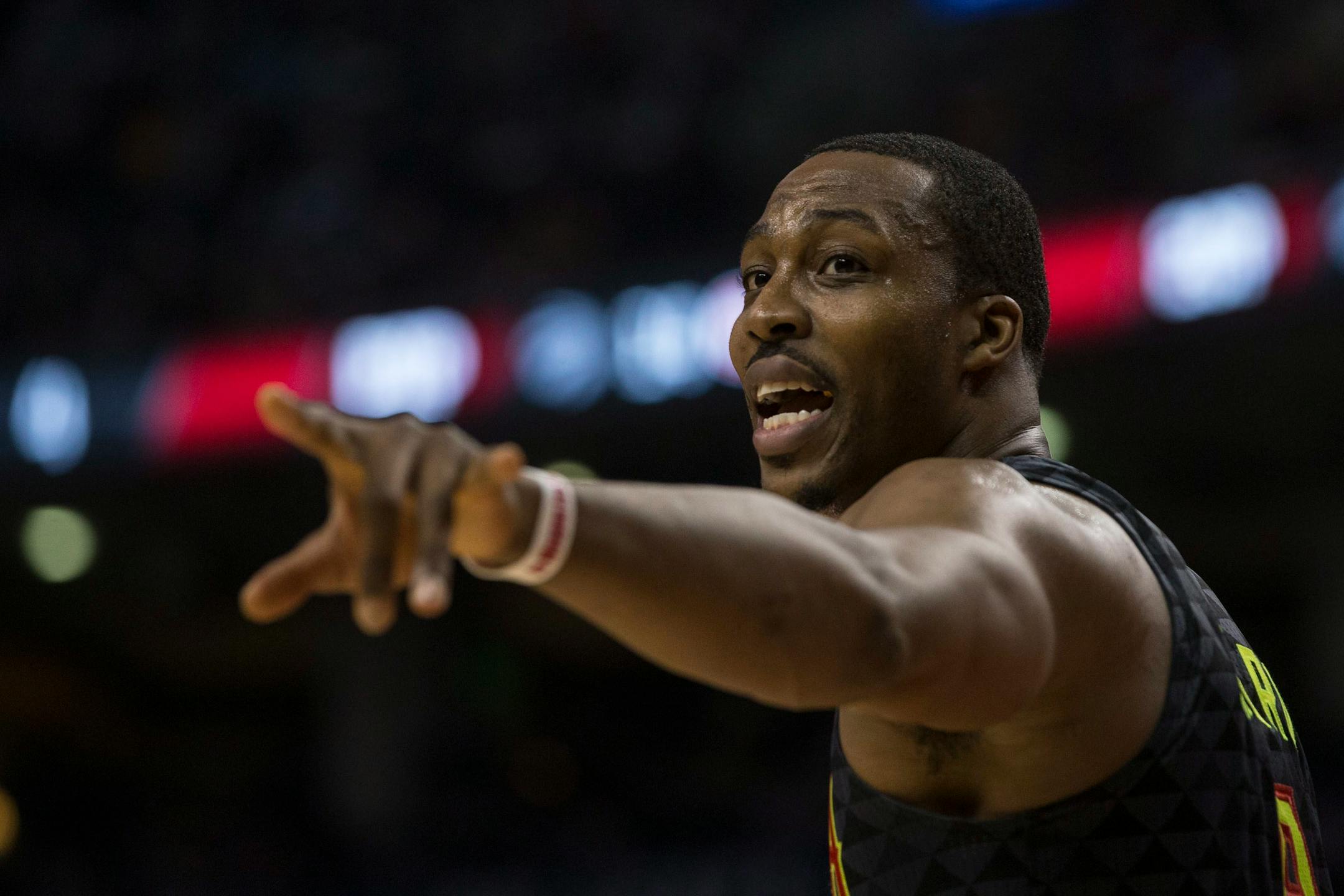 Atlanta Hawks' Dwight Howard directs a teammate during first-half NBA basketball game action against the Toronto Raptors in Toronto, Friday, Dec. 16, 2016. (Chris Young/The Canadian Press via AP)