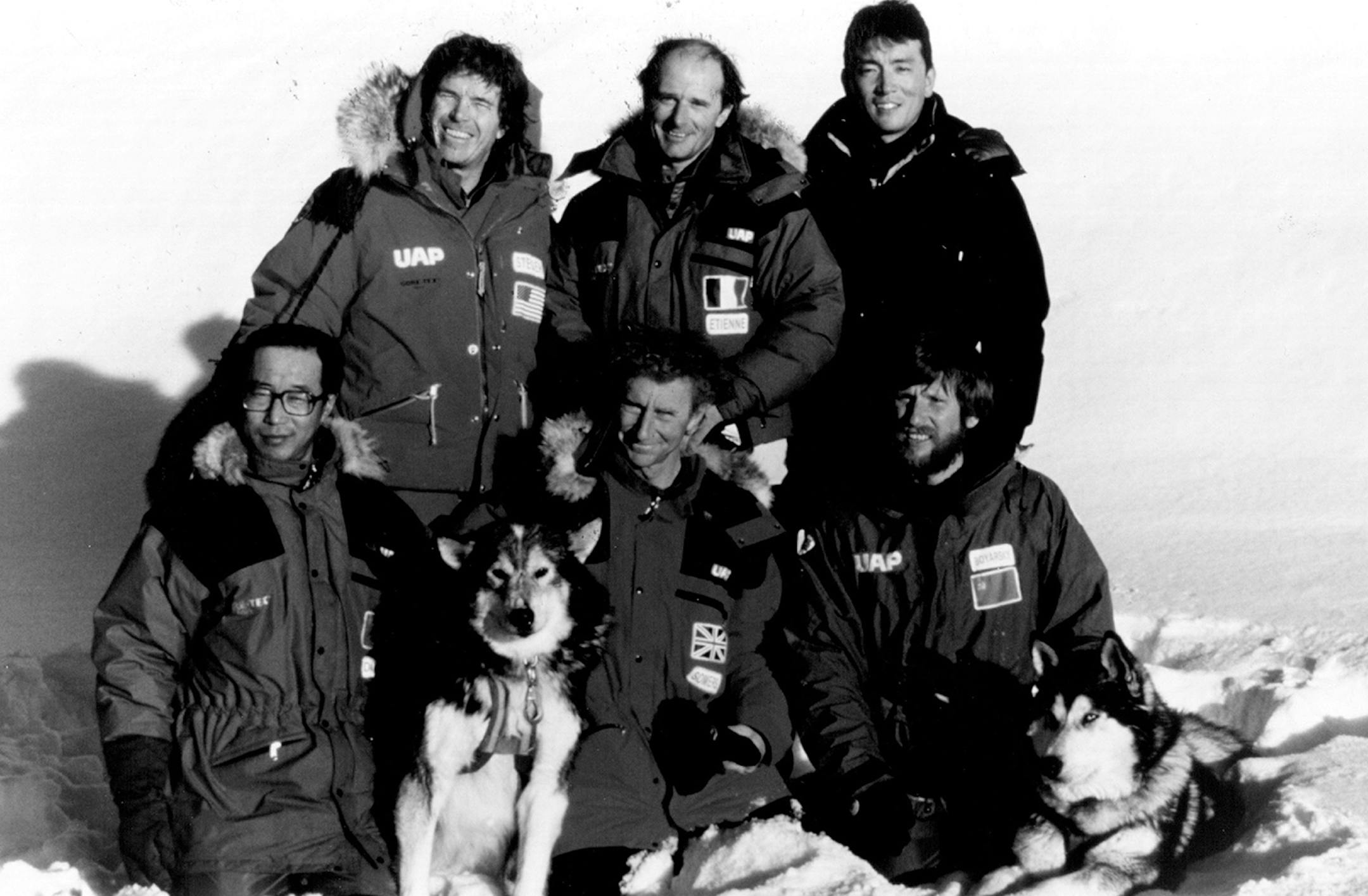The 1990 International Trans-Antarctica Expedition will serve as a demonstration of the power and spirit of international cooperation. Front row, left to right: Qin Dahe of China, Geoff Somers of Great Britian and Victor Boyarsky of the Soviet Union. Back row, left to right: Will Steger of the United States, Jean-Louis Etienne of France and Keizo Funatsu of Japan.