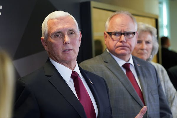 Vice President Mike Pence and Minnesota Gov. Tim Walz spoke to the press after Pence visited 3M in Maplewood in March. On the right is Health Commissi