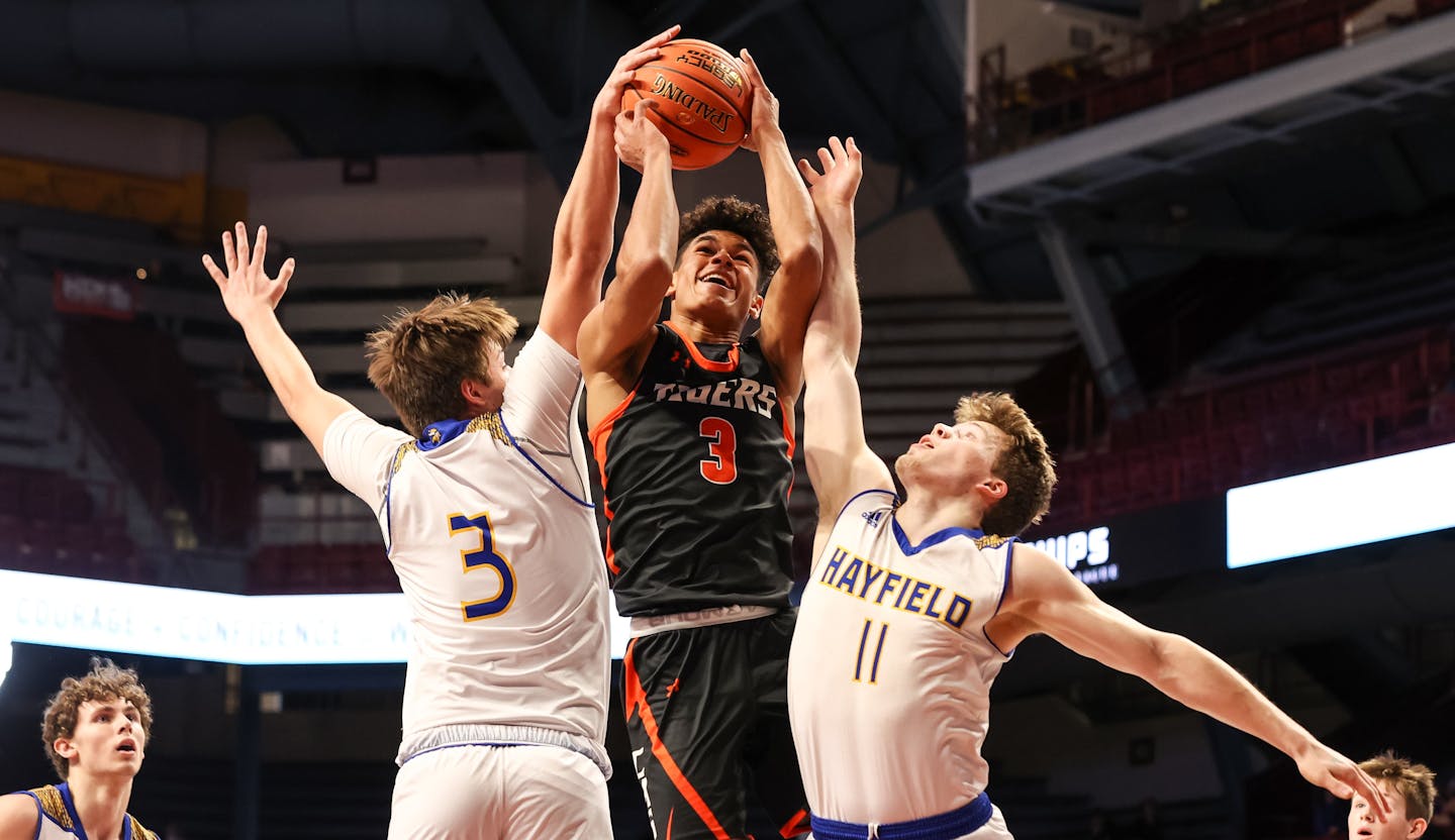 Cherry's Isaac Asuma (3) shoots through defenders Zander Jacobson (3) and Isaac Matti (11). Asuma led all scoring with 36 points and 9 rebounds. Photo by Cheryl A. Myers, SportsEngine