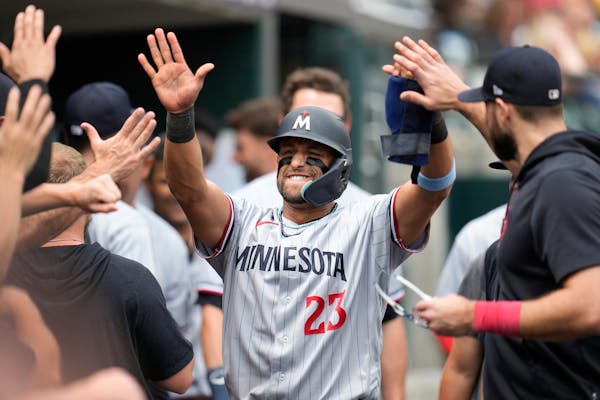 Minnesota Twins' Royce Lewis (23) celebrates scoring against the Detroit Tigers in the 10th inning of a baseball game, Sunday, June 25, 2023, in Detro