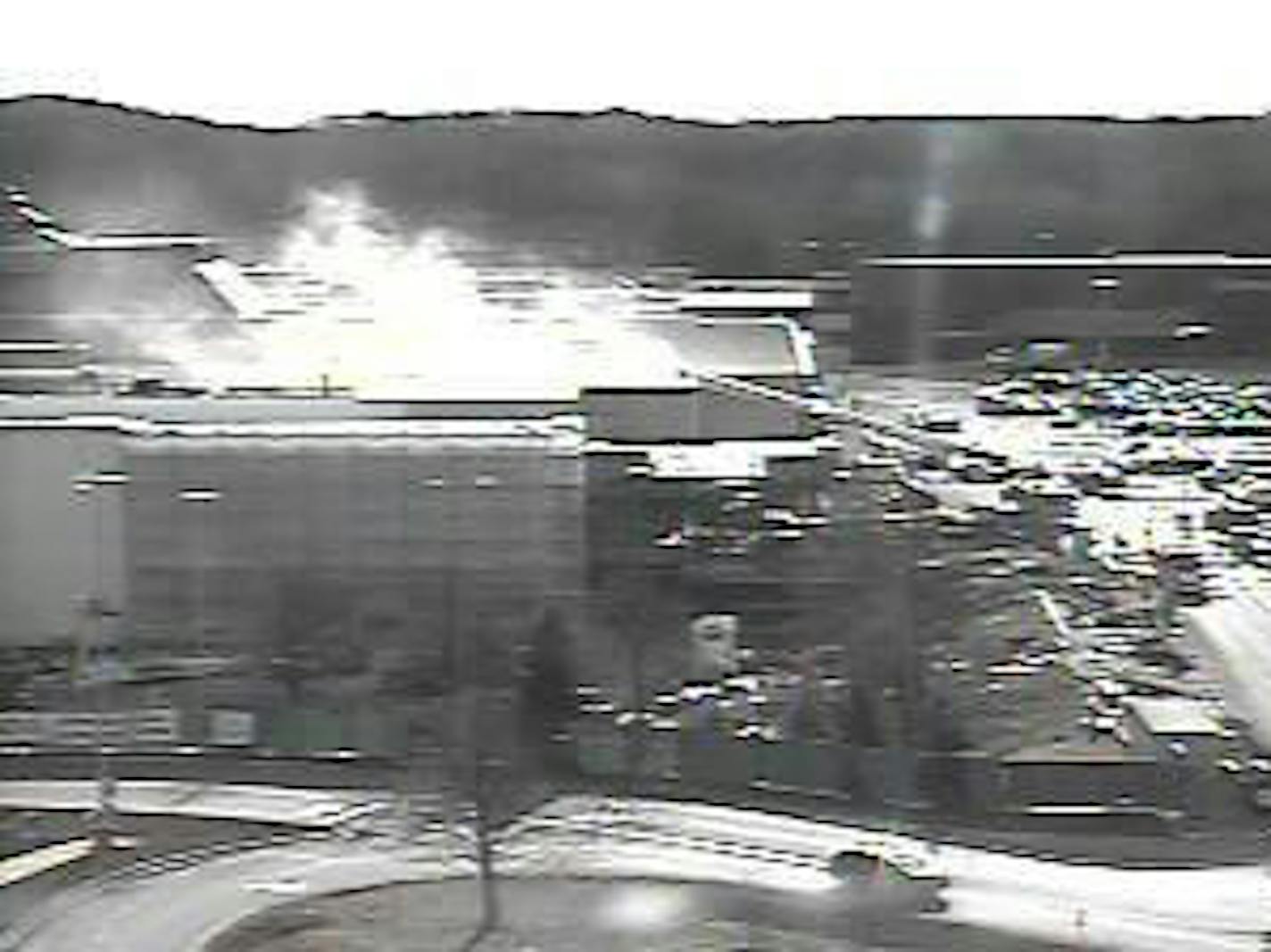 Smoke can be seen coming from the roof of Macy's at Ridgedale Mall in this MnDOT traffic camera photo.