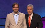 Chaska Middle School West teacher, Peter Buchholz, stands with Jeopardy host, Alex Trebek. Buchholz and 15 other teachers will compete for $100,000 Je