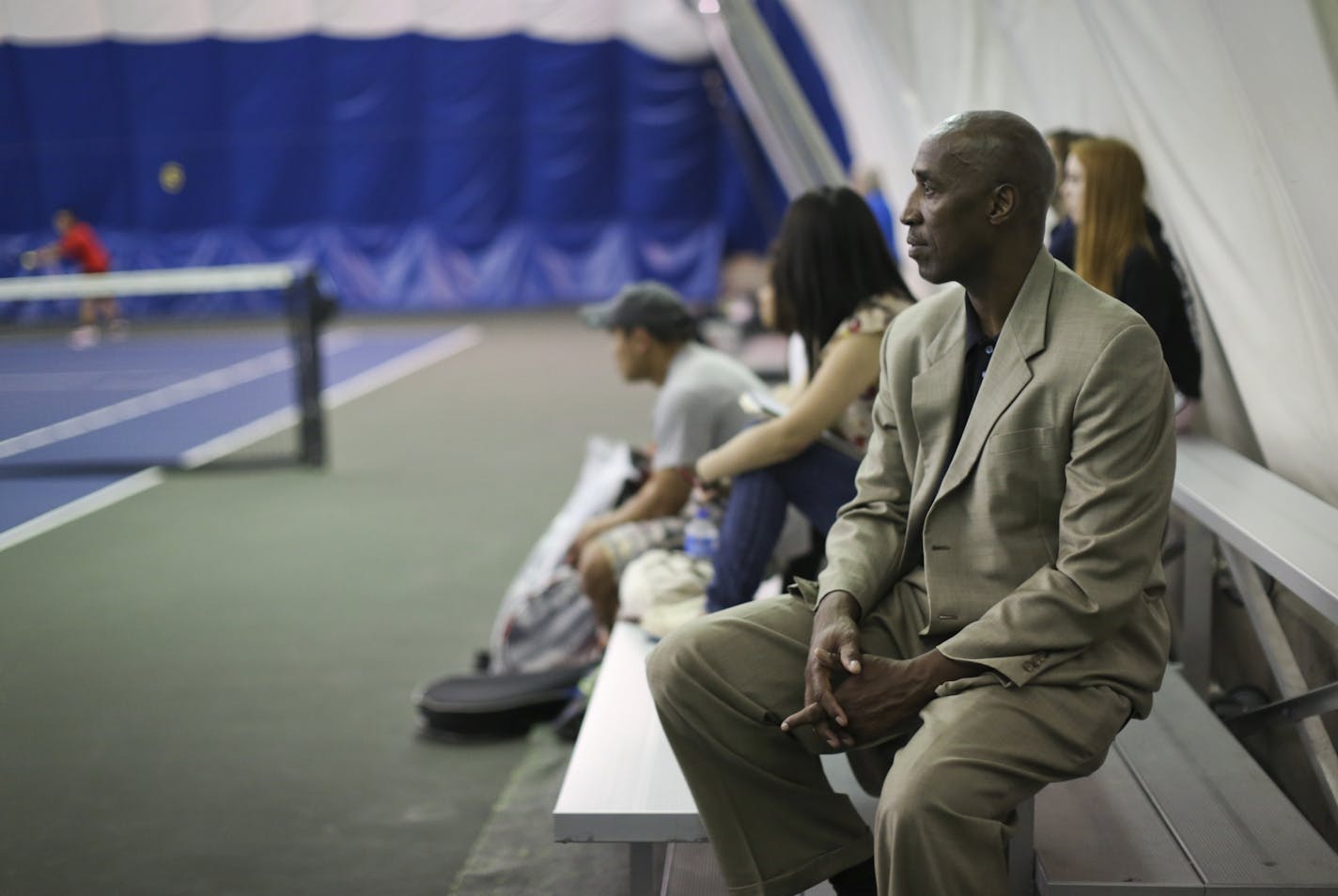 Minneapolis Public Schools Athletic Director Trent Tucker watched a tennis match in 2013. He resigned from his post on Thursday.