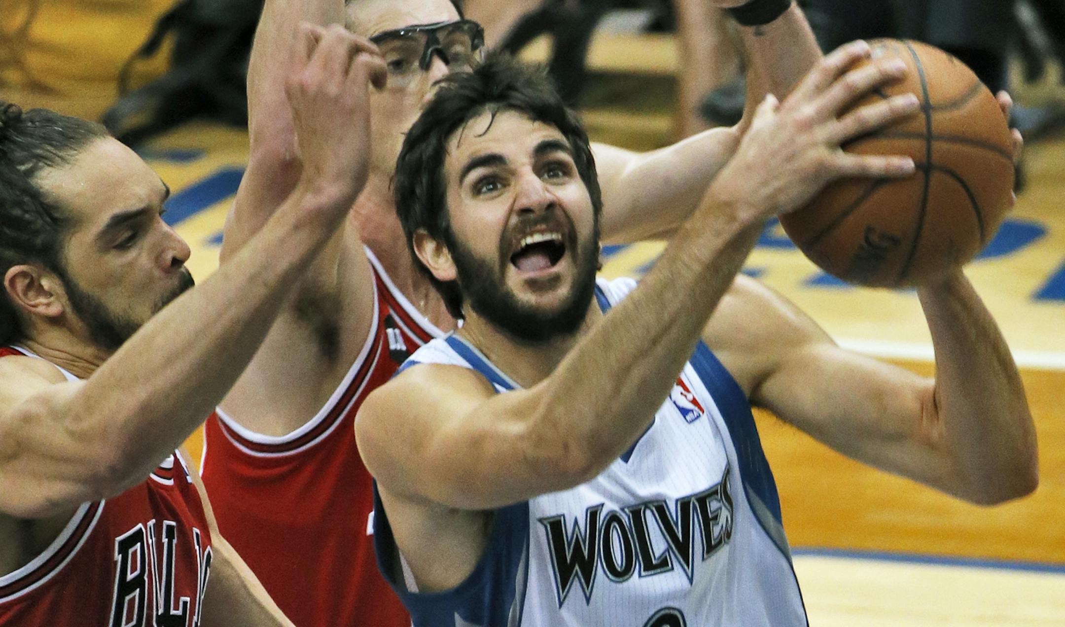 Ricky Rubio fights for a layup.