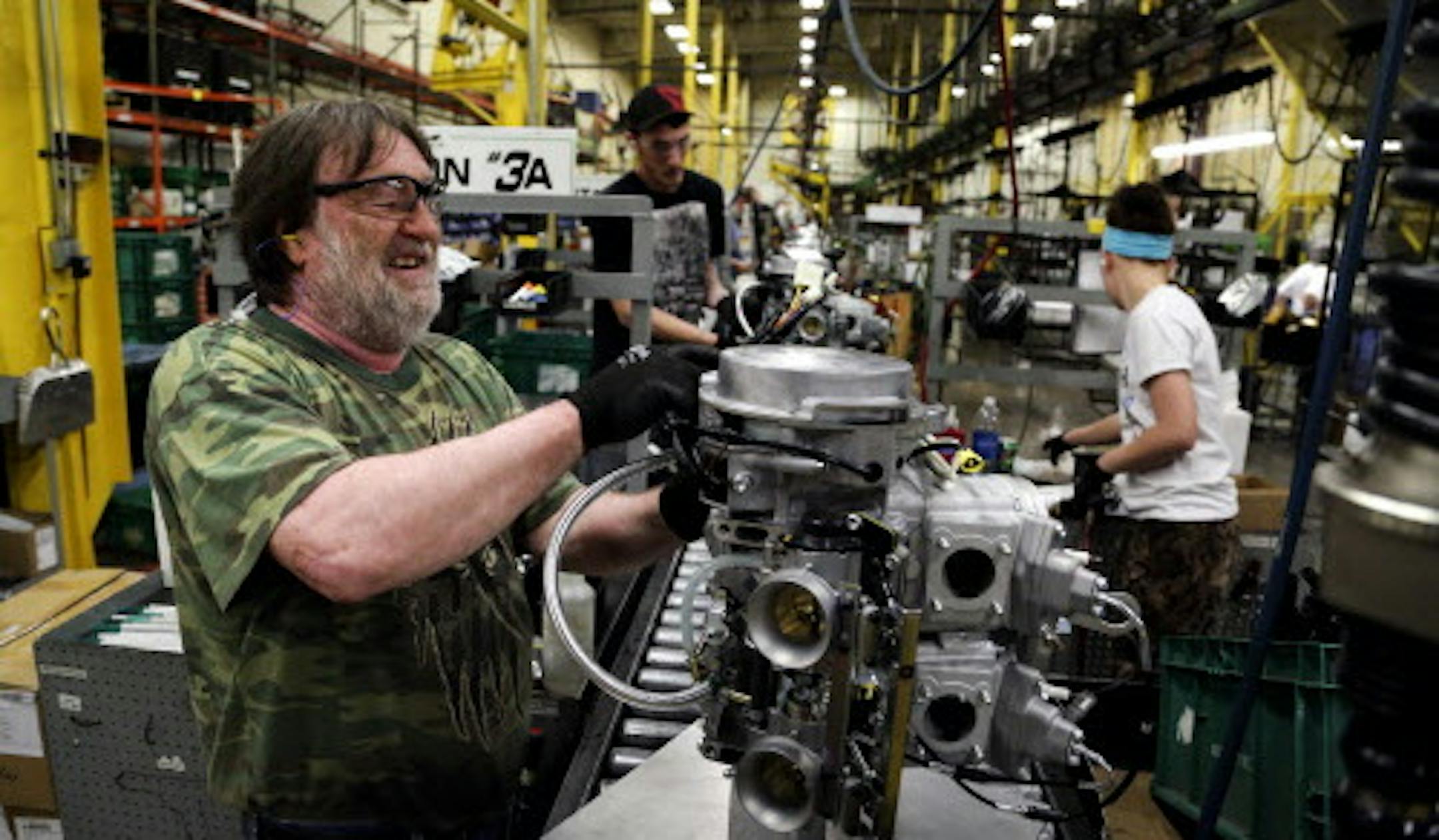 Arctic Cat employee Norman Olson prepares an engine for assembly in the XF 800 Artic Cat snowmobile at Arctic Cat's muanufacturing facility Wednesday, May 15, 2013 in Thief River Falls, MN. The snowmobile giant employs about 1,300 workers in Thief River Falls.](DAVID JOLES/STARTRIBUNE) djoles@startribune Pennington County is an island of growth in a sea of economic contraction in northwest Minnesota. Since 2000, job growth in the county has quadrupled population growth, making it an anomaly both
