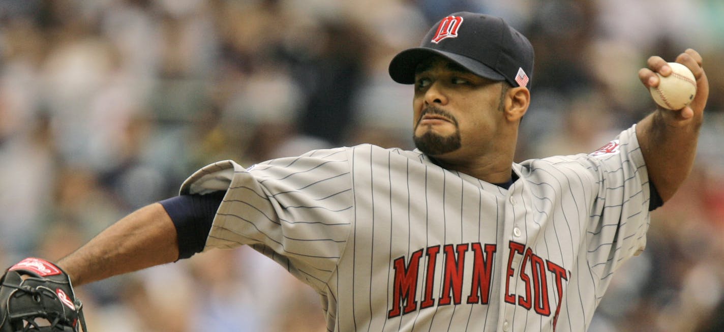 ** FILE ** Minnesota Twins' Johan Santana delivers a pitch against the New York Yankees in the first inning of their baseball game at Yankee Stadium in New York, in this July 4, 2007 file photo. The Minnesota Twins reached a tentative agreement Tuesday, Jan. 29, 2008, to trade Johan Santana to the New York Mets. After months of deliberation, the Twins agreed to send the two-time Cy Young Award winner to the Mets for outfielder Carlos Gomez, and pitchers Phil Humber, Deolis Guerra and Kevin Mulve