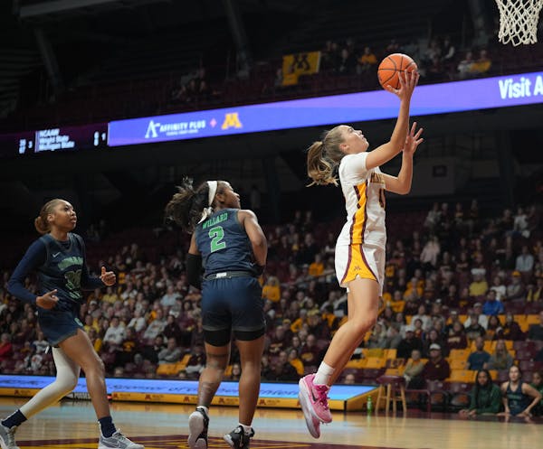 Gophers guard Mara Braun, who scored 25 points, drove for a layup during the second half Sunday at Williams Arena. Minnesota won 100-42.