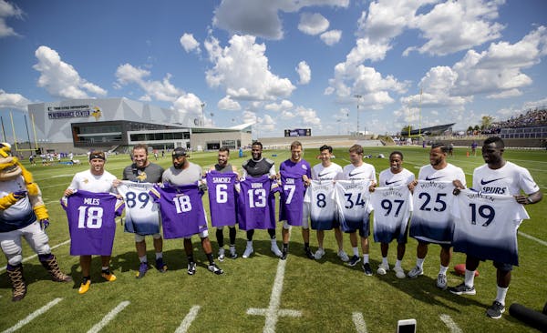 Vikings players posed with players from Tottenham Hotspur at the new TCO Performance Center in Eagan.