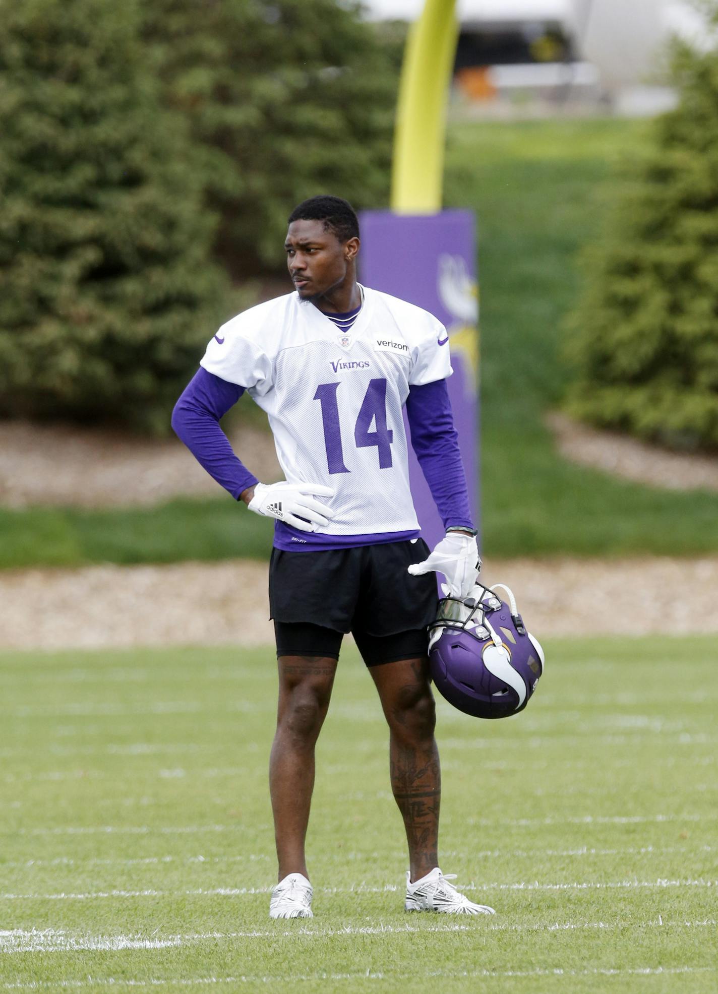 Minnesota Vikings wide receiver Stefon Diggs takes a break during practice at the NFL football team's training camp Wednesday, May 23, 2018, in Eagan, Minn. Diggs has entered the final year of his rookie contract with the Minnesota Vikings, bound for a big raise. He's also working with his fourth primary starting quarterback in as many NFL seasons and his third offensive coordinator.(AP Photo/Jim Mone)