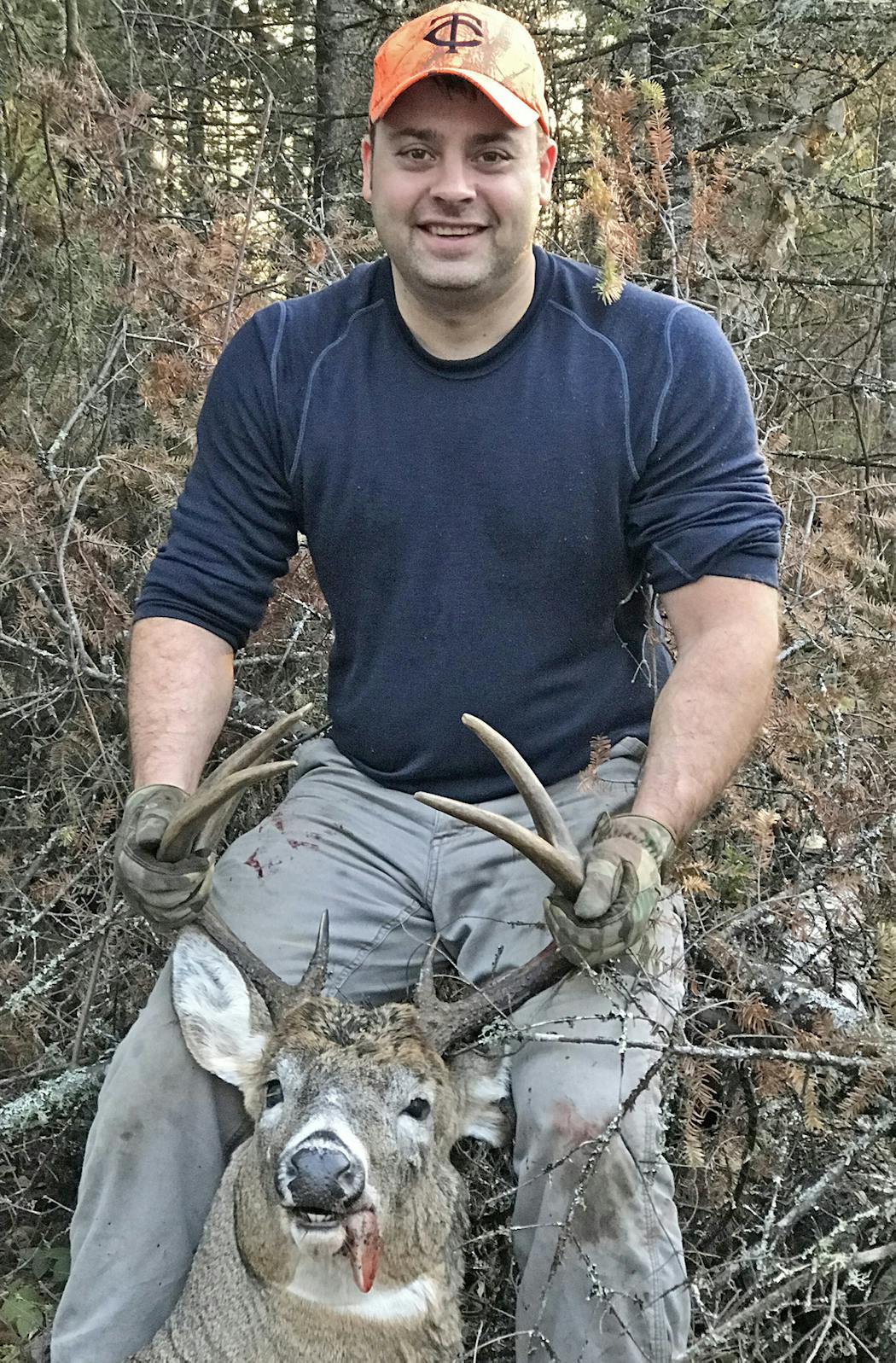 Jason Brown, 38, of Blaine hunts the Arrowhead Country west of Ely and is regularly joined there in deer season by his dad, Curt Brown, 64, of Roseville. This hefty 8-pointer showed himself in a clear-cut.
