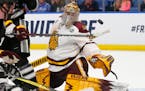 Minnesota Duluth goalie Hunter Shepard made a save against Providence in the NCAA Frozen Four semifinals.
