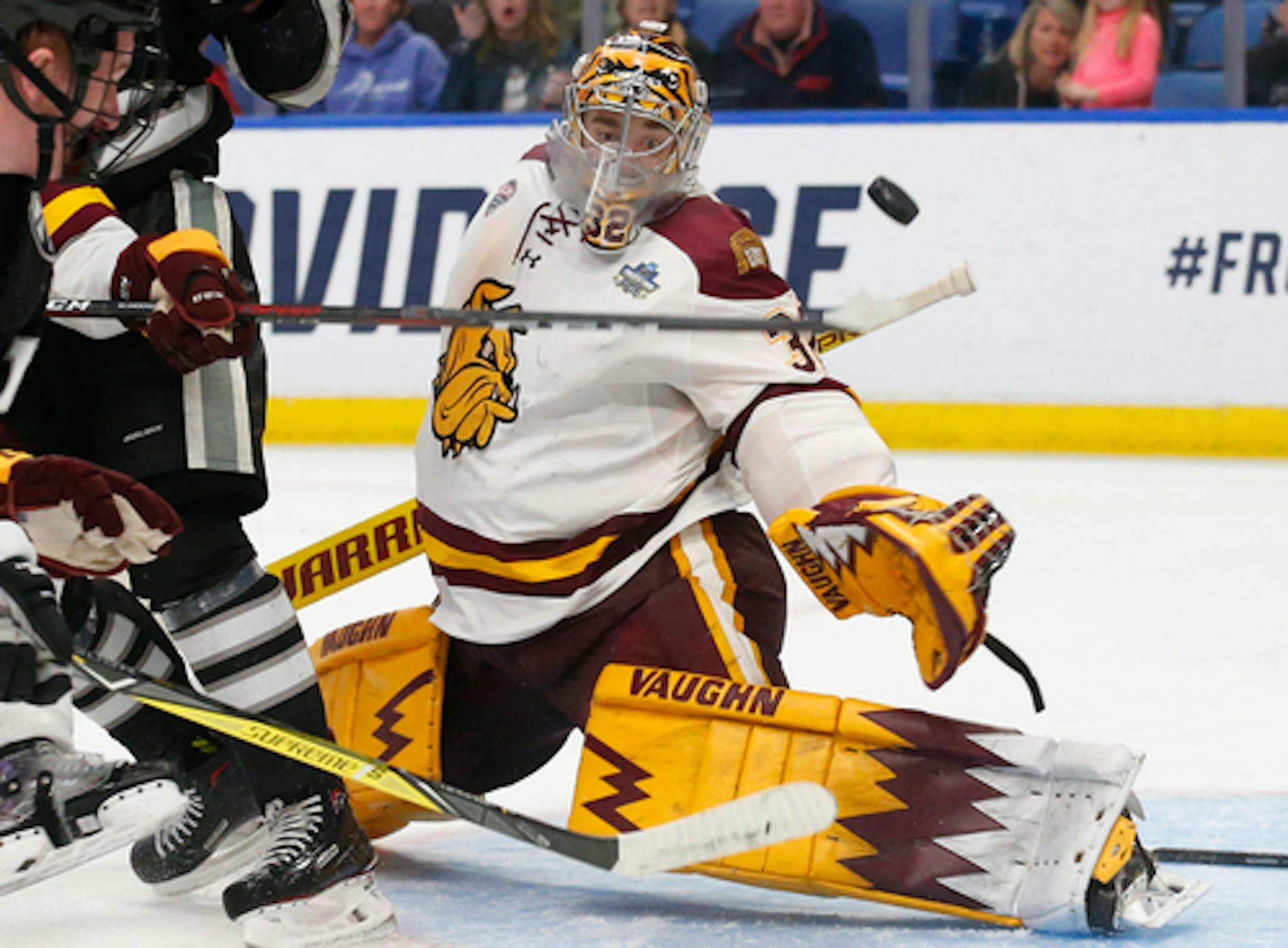 Minnesota Duluth goalie Hunter Shepard made a save against Providence in the NCAA Frozen Four semifinals.