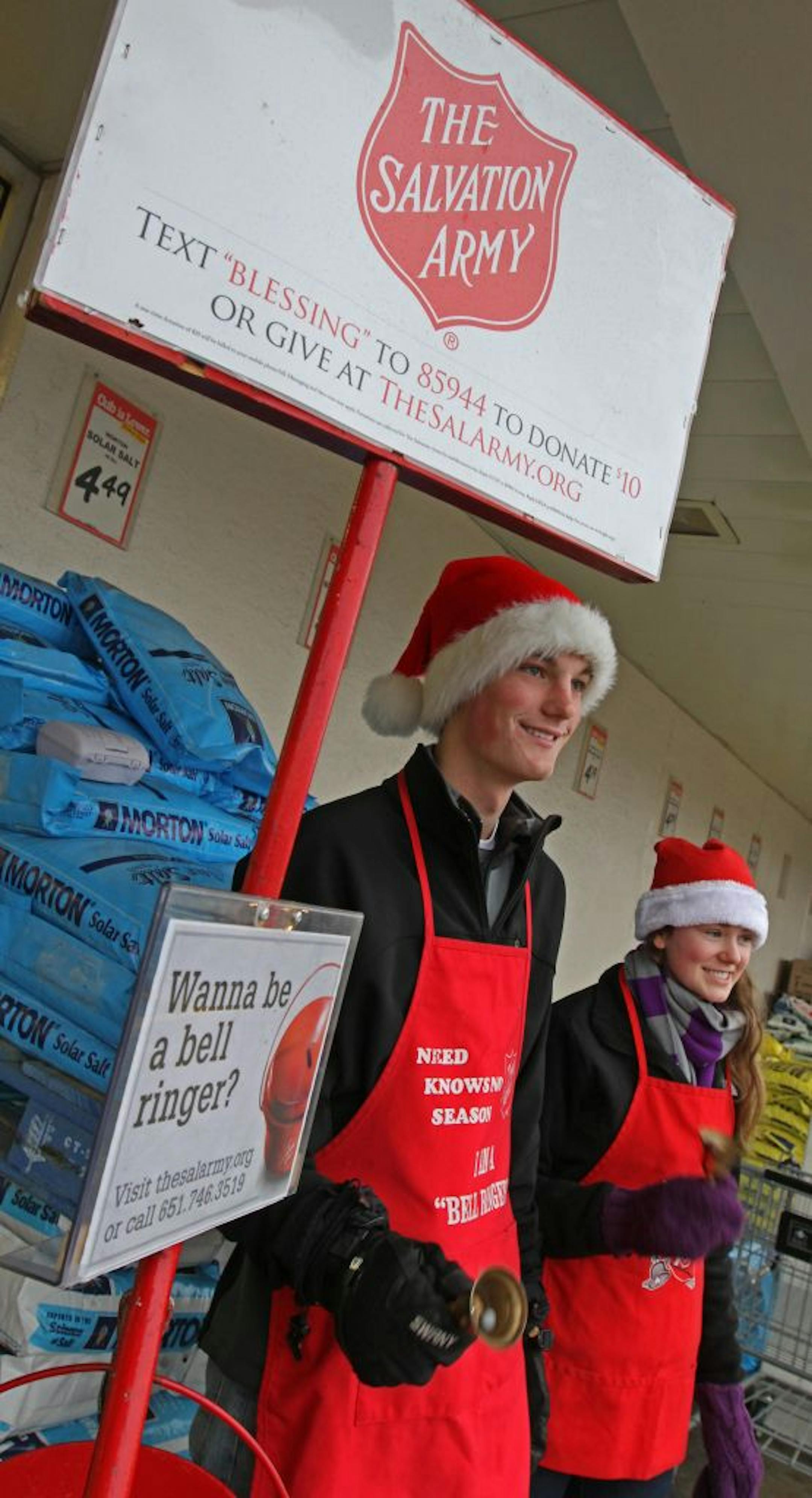 Schmidt and Becker added Santa hats to their required red aprons as they helped raise donations for the Salvation Army.