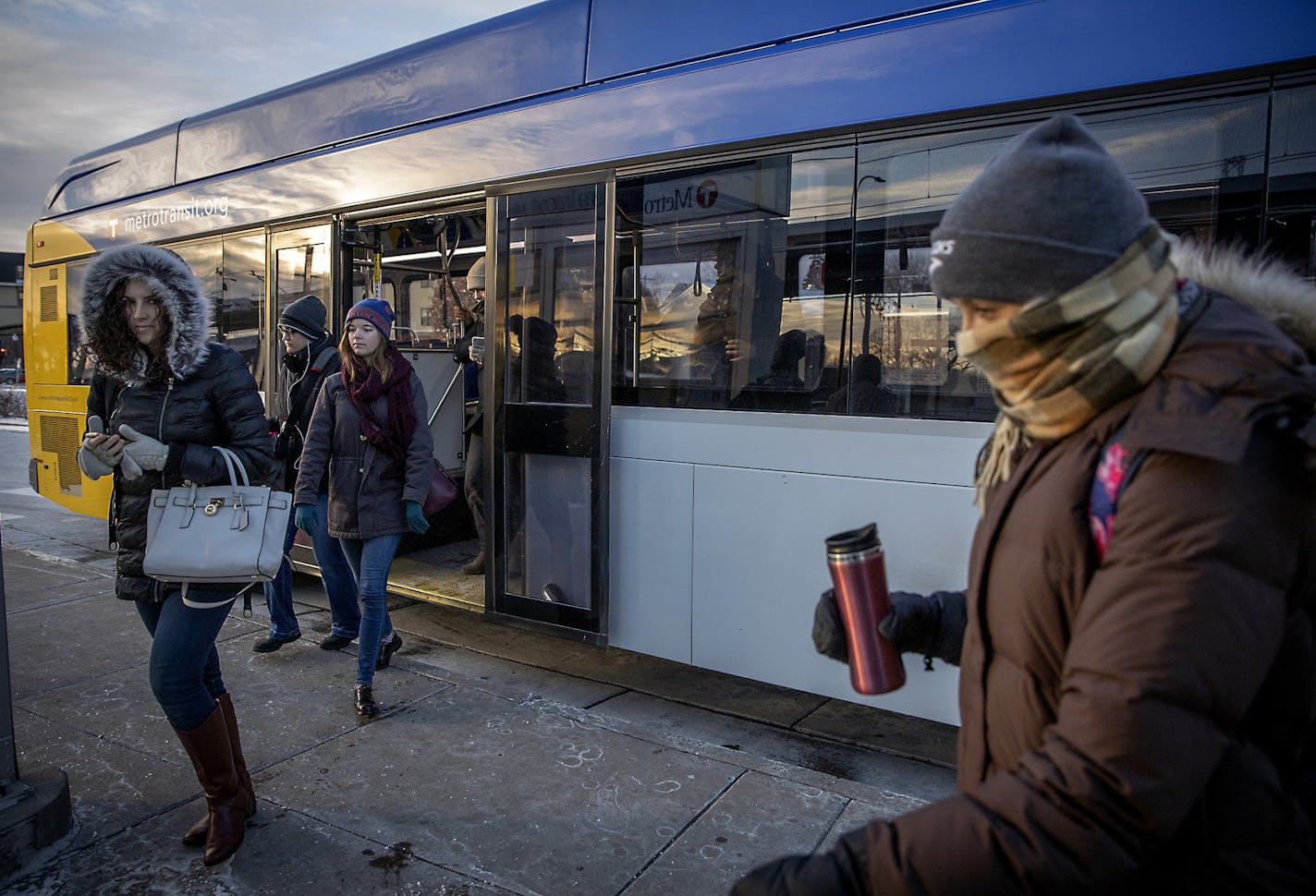 A-Line bus passengers made their way off the bus at the stop at the 46th Street Blue Line LRT station, Friday, January 25, 2019 in Minneapolis, MN. The first rapid-bus line, the A Line, opened in 2016 and has been widely viewed as a runaway success. More lines are under construction, including the C and D Lines, both of which serve north Minneapolis. ] ELIZABETH FLORES &#x2022; liz.flores@startribune.com