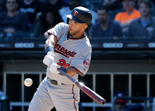Minnesota Twins' Eddie Rosario hits a solo home run against the Chicago White Sox during the ninth inning of a baseball game Sunday, May 6, 2018, in C