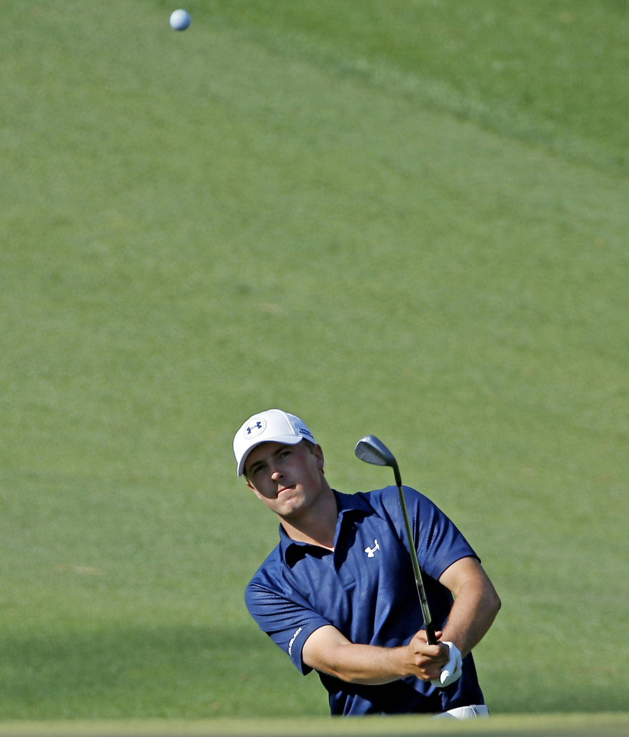 Jordan Spieth chips to the 10th green during the third round of the Masters golf tournament Saturday, April 12, 2014, in Augusta, Ga. (AP Photo/David J. Phillip)