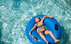 A young girl thoroughly enjoyed her experience in the lazy river at Bunker Beach Water Park in Coon Rapids Tuesday. ] Aaron Lavinsky • aaron.lavinsk