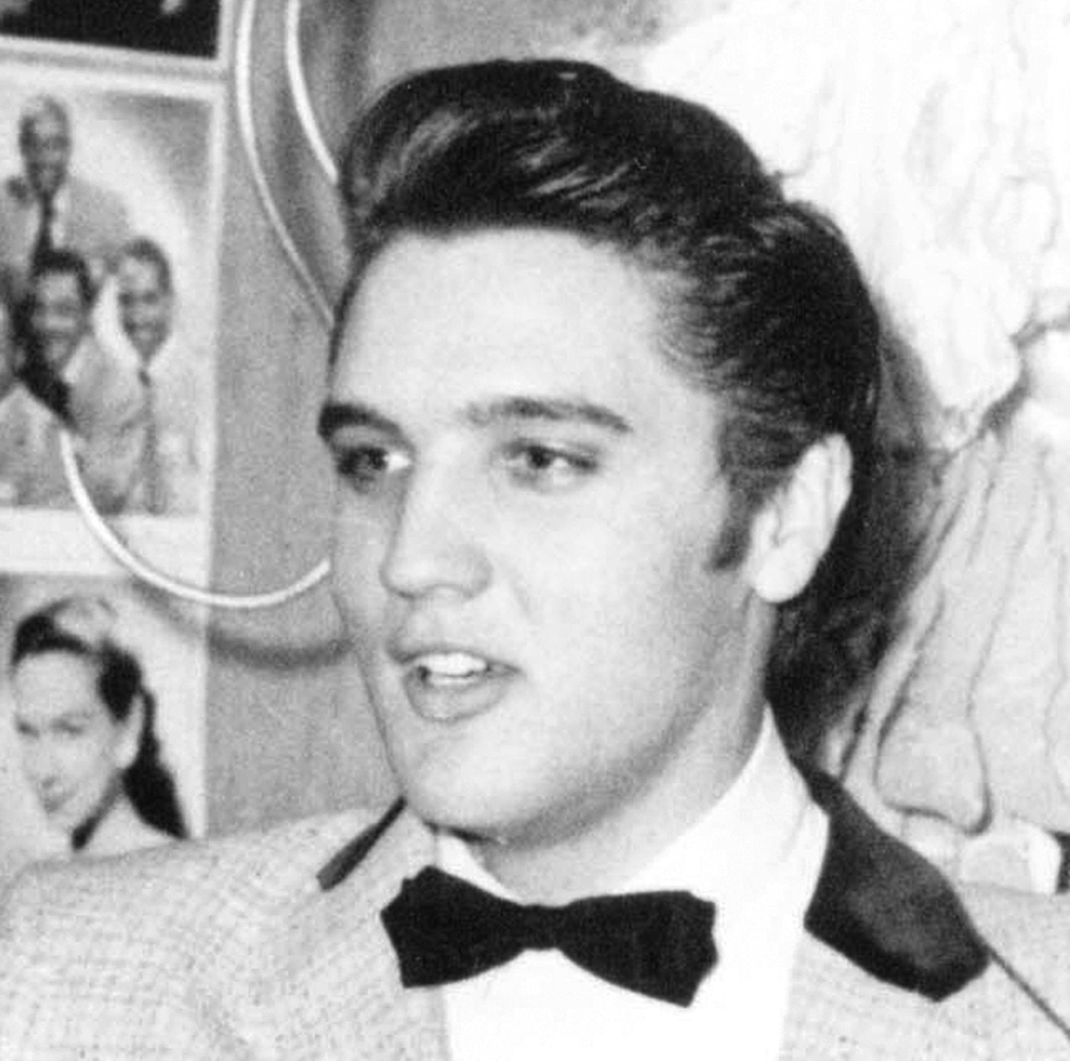 In this April 30, 1956, file photo, Elvis Presley is shown at the New Frontier Hotel in Las Vegas. One of the first stages Elvis sang on has been refinished during the renovation of the auditorium at his elementary school in Tupelo, Miss., the Northeast Mississippi Daily Journal reported Friday, July 21, 2017. Elvis Presley Birthplace employee Judy Schumpert says the rock 'n' roll king's time at Lawhon was instrumental in helping him pursue music as a boy. Schumpert says Presley's fifth-grade te