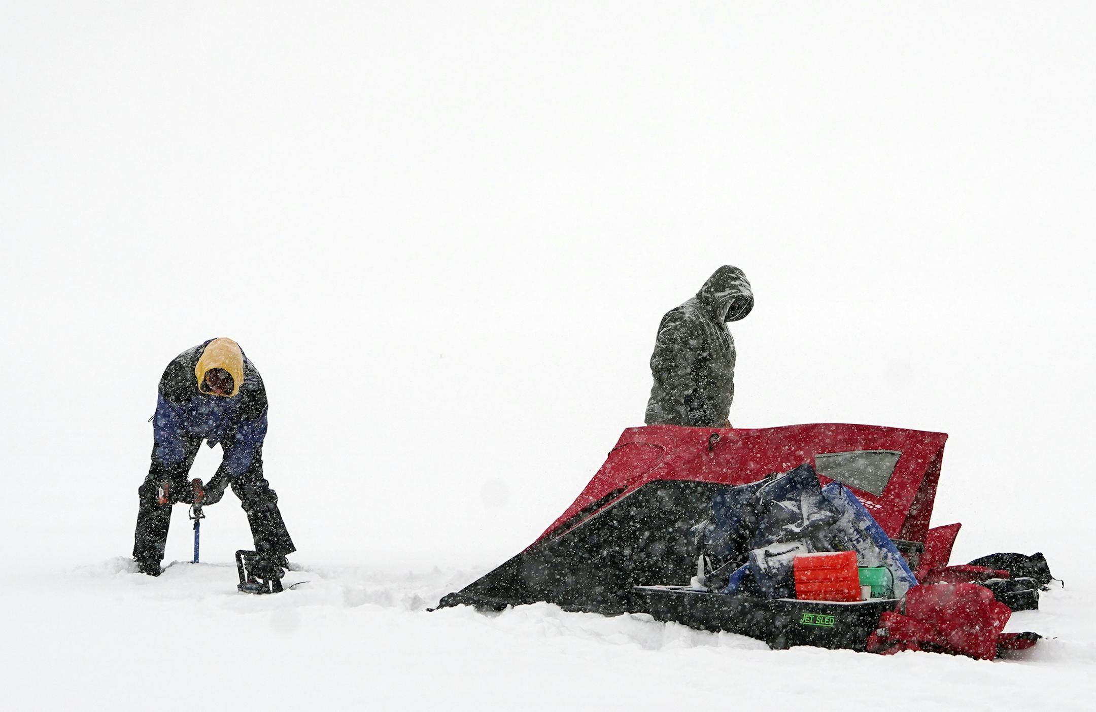 L to R: Daryl Larson and Matt Berkowitz found the conditions ideal for ice fishing. The fact that they were not working made them ideal. They were going for some perch and walleye.] Weather features around the metro. RICHARD TSONG-TAATARII ¥ richard.tsong-taatarii@startribune.com