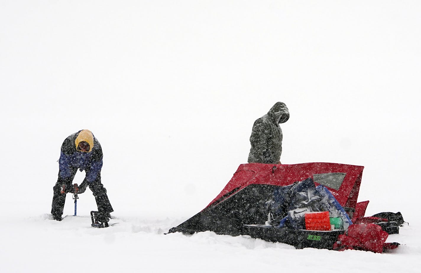 L to R: Daryl Larson and Matt Berkowitz found the conditions ideal for ice fishing. The fact that they were not working made them ideal. They were going for some perch and walleye.] Weather features around the metro. RICHARD TSONG-TAATARII &#xa5; richard.tsong-taatarii@startribune.com