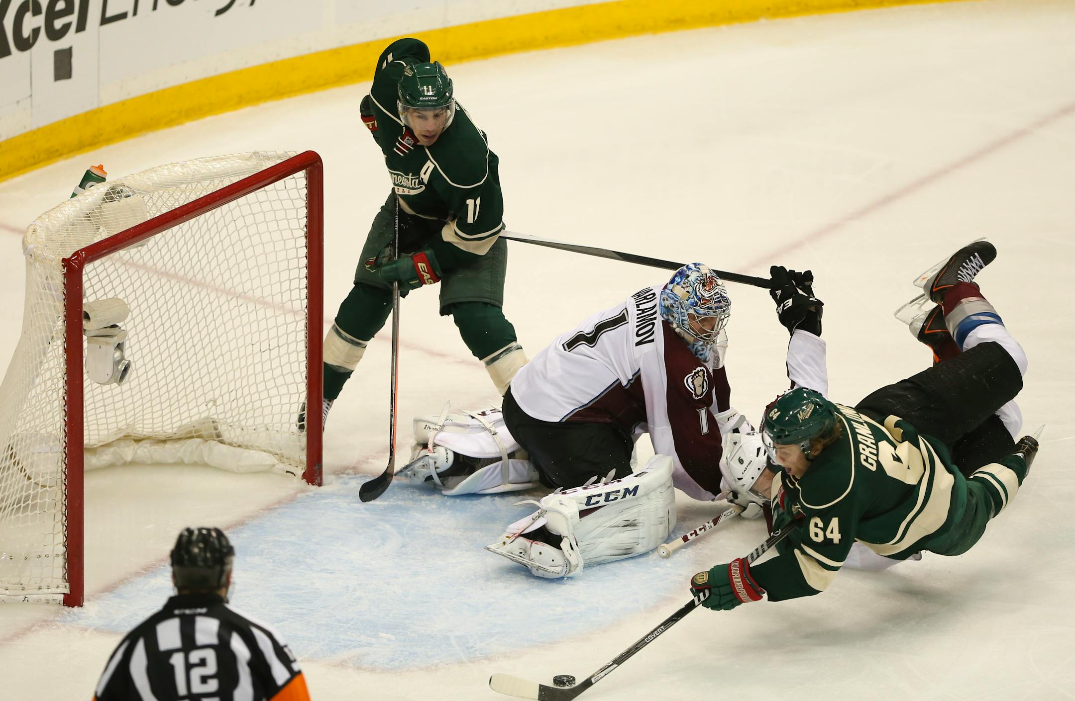 With Colorado Avalanche center Matt Duchene (9) all over him, Minnesota Wild center Mikael Granlund (64) slipped the winning goal past Colorado Avalanche goalie Semyon Varlamov (1) as he was falling over in front of the crease. ] JEFF WHEELER â€¢ jeff.wheeler@startribune.com The Minnesota Wild beat the Colorado Avalanche 1-0 in overtime in Game 3 of their NHL playoff series Monday night, April 21, 2014 at Xcel Energy Center in St. Paul.