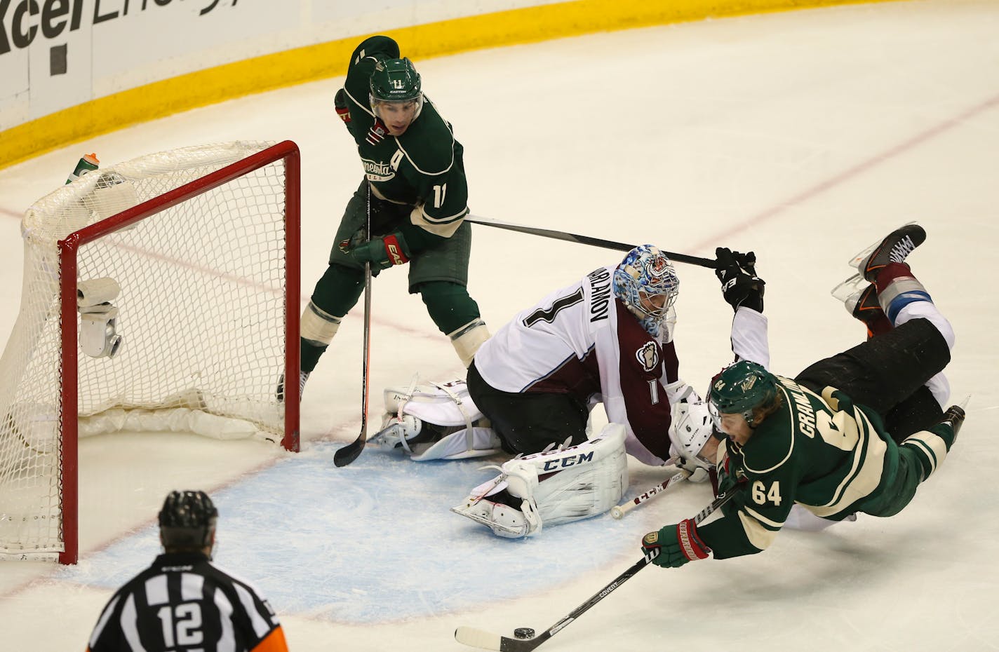 With Colorado Avalanche center Matt Duchene (9) all over him, Minnesota Wild center Mikael Granlund (64) slipped the winning goal past Colorado Avalanche goalie Semyon Varlamov (1) as he was falling over in front of the crease. ] JEFF WHEELER â€¢ jeff.wheeler@startribune.com The Minnesota Wild beat the Colorado Avalanche 1-0 in overtime in Game 3 of their NHL playoff series Monday night, April 21, 2014 at Xcel Energy Center in St. Paul.