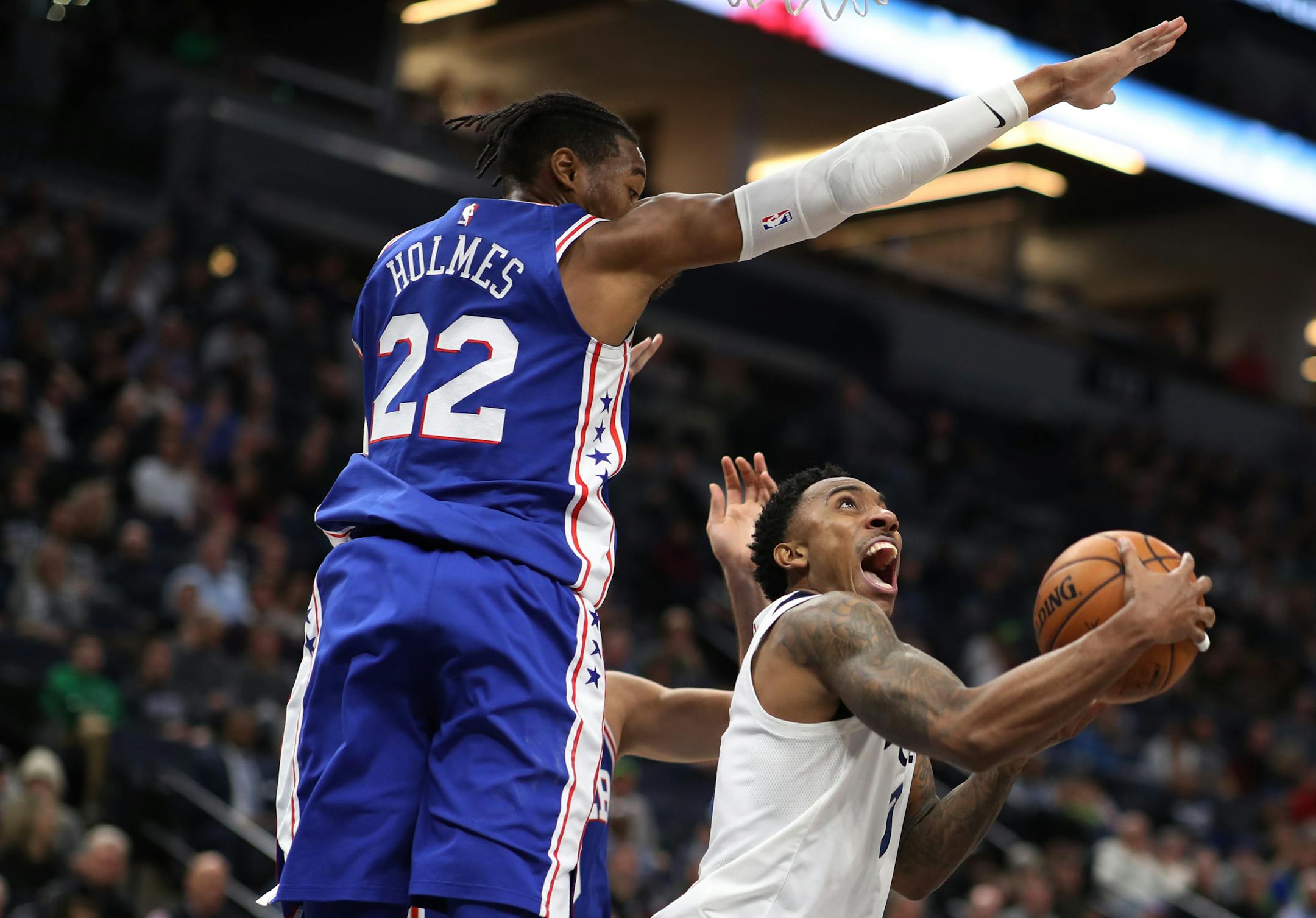 Minnesota Timberwolves guard Jeff Teague (0) scored on a layup over Philadelphia 76ers forward Richaun Holmes (22) during NBA action at Target Center Tuesday December 12, 2017 in Minneapolis, MN.] The Minnesota Timberwolves hosted the Philadelphia 76ers at Target Center. JERRY HOLT � jerry.holt@startribune.com