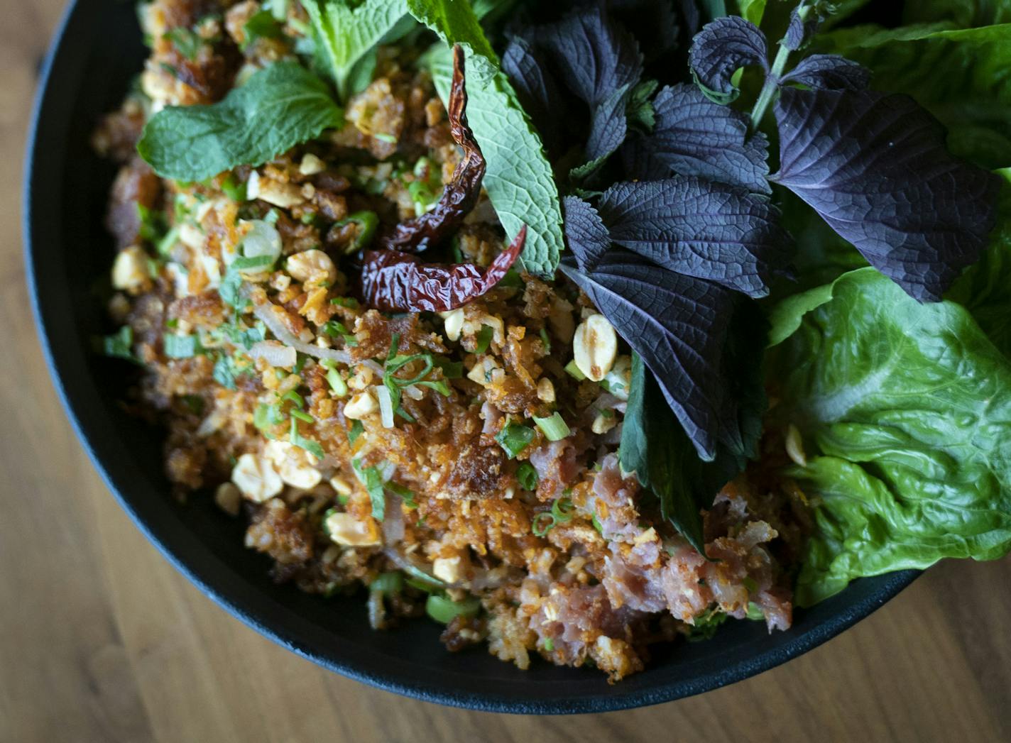 The Nam Khao with crispy rice, Thai herb salad, nam, and peanuts at Lat 14 Golden Valley, Minn., on Friday, November 1, 2019. ] RENEE JONES SCHNEIDER &#xa5; renee.jones@startribune.com