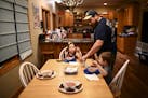 Steve Denzine, a Sandstone prison employee, served up dinner for his wife, Beth, and their two children, Robbie, 3, and Stella, 6, Wednesday night.