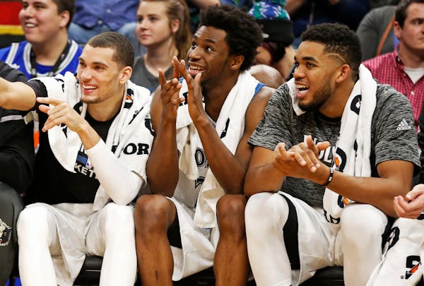 Minnesota Timberwolves' Zach LaVine, left, Andrew Wiggins, center and Karl-Anthony Towns