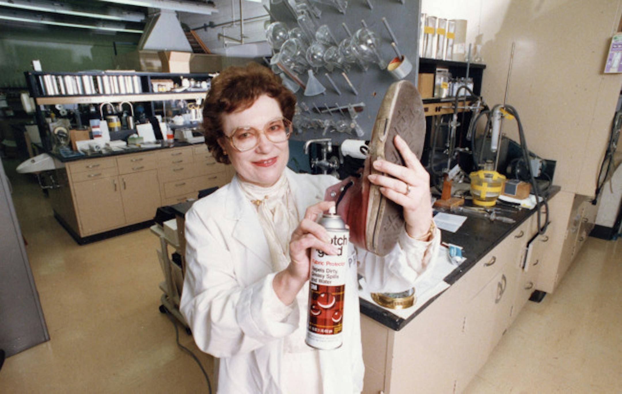 Patsy O. Sherman, co-inventor of Scotchgard gave a squirt to a tennis shoe