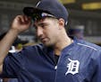Detroit Tigers' Nick Castellanos visits the dugout before a baseball game against the Boston Red Sox, Sunday, Aug. 21, 2016, in Detroit. Castellanos i