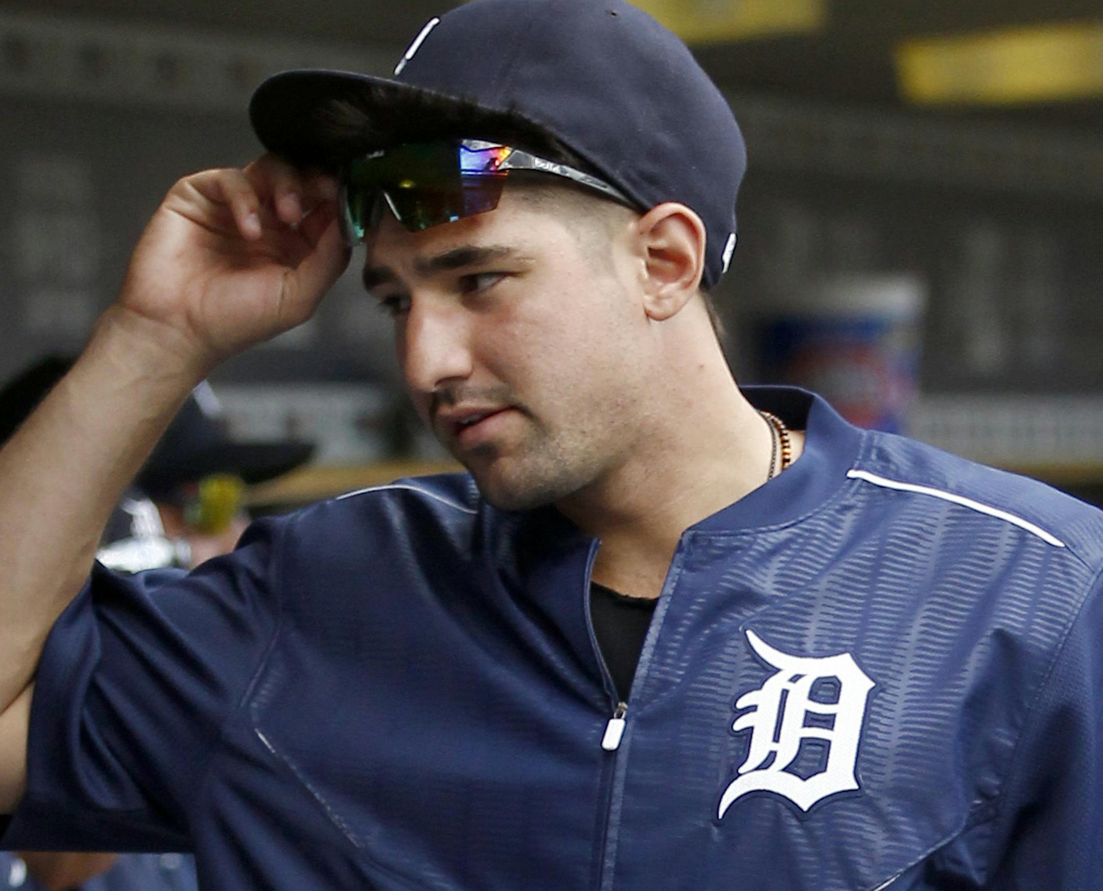 Detroit Tigers' Nick Castellanos visits the dugout before a baseball game against the Boston Red Sox, Sunday, Aug. 21, 2016, in Detroit. Castellanos injured his left hand when he was hit by a pitch on Aug. 6. (AP Photo/Duane Burleson)