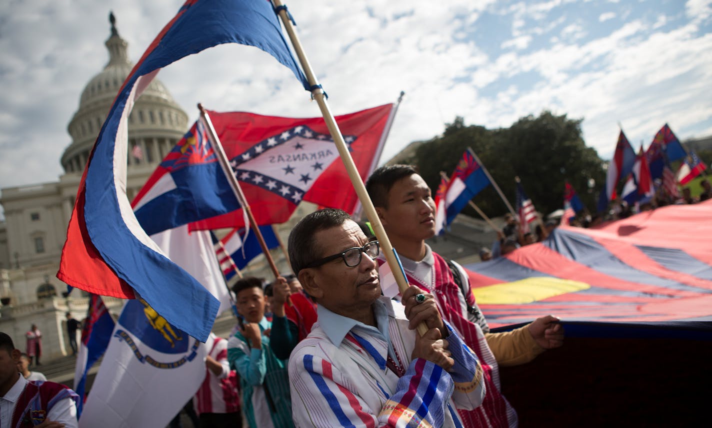 Members of the Karen ethnic group hold a giant Karen flag as they rally to bring attention to the human rights violations towards religious and ethnic minorities in the Burma region, in front of the U.S. Capitol building on Capitol Hill in Washington, D.C., November 6, 2017. As resettlement of Karen refugees to the United States winds down, advocacy efforts have increased in support of more than 120,000 Karen who remain in Thai refugee camps. (photo by Allison Shelley for the Minneapolis Star Tr