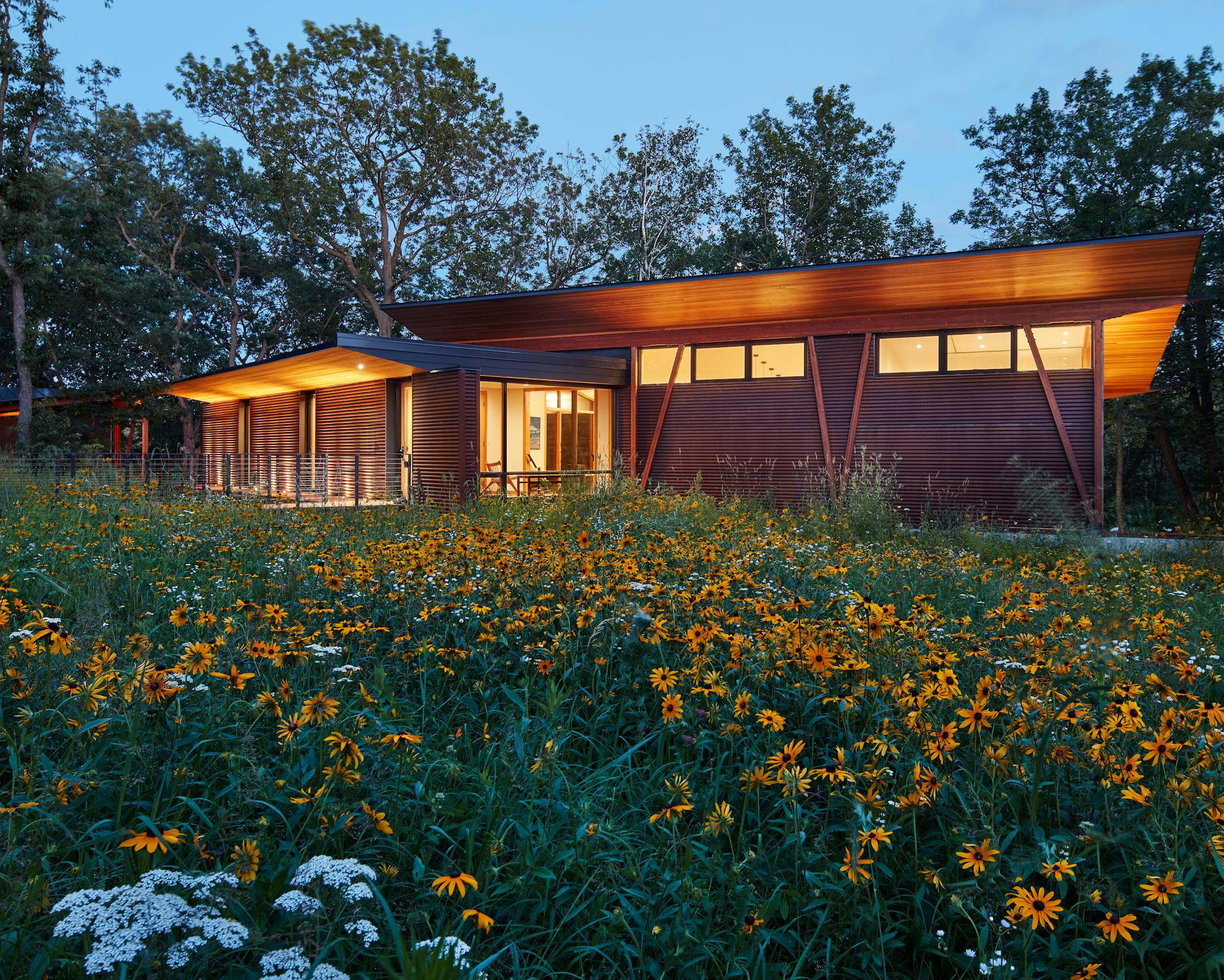 Set against a backdrop of rolling hills and prairie, SALA Architect's Home of the Month winning retreat is an restorative getaway in Frederic, Wis. that also restores the land.