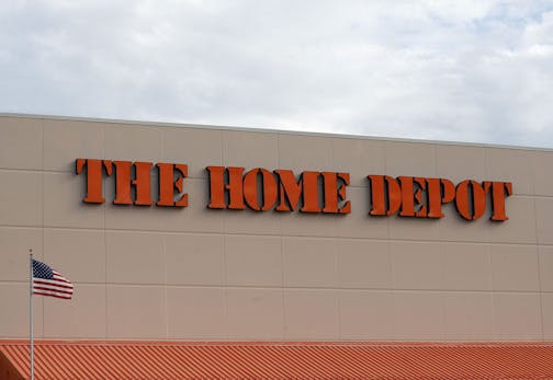 FILE - In this Aug. 27, 2019 file photo, the Home Depot logo is shown on a store in Bloomington, Minn. Home Depot's fiscal second-quarter sales surged to easily top Wall Street's expectations as consumers continued working on home projects and gardening amid the coronavirus outbreak. (AP Photo/Jim Mone, File)