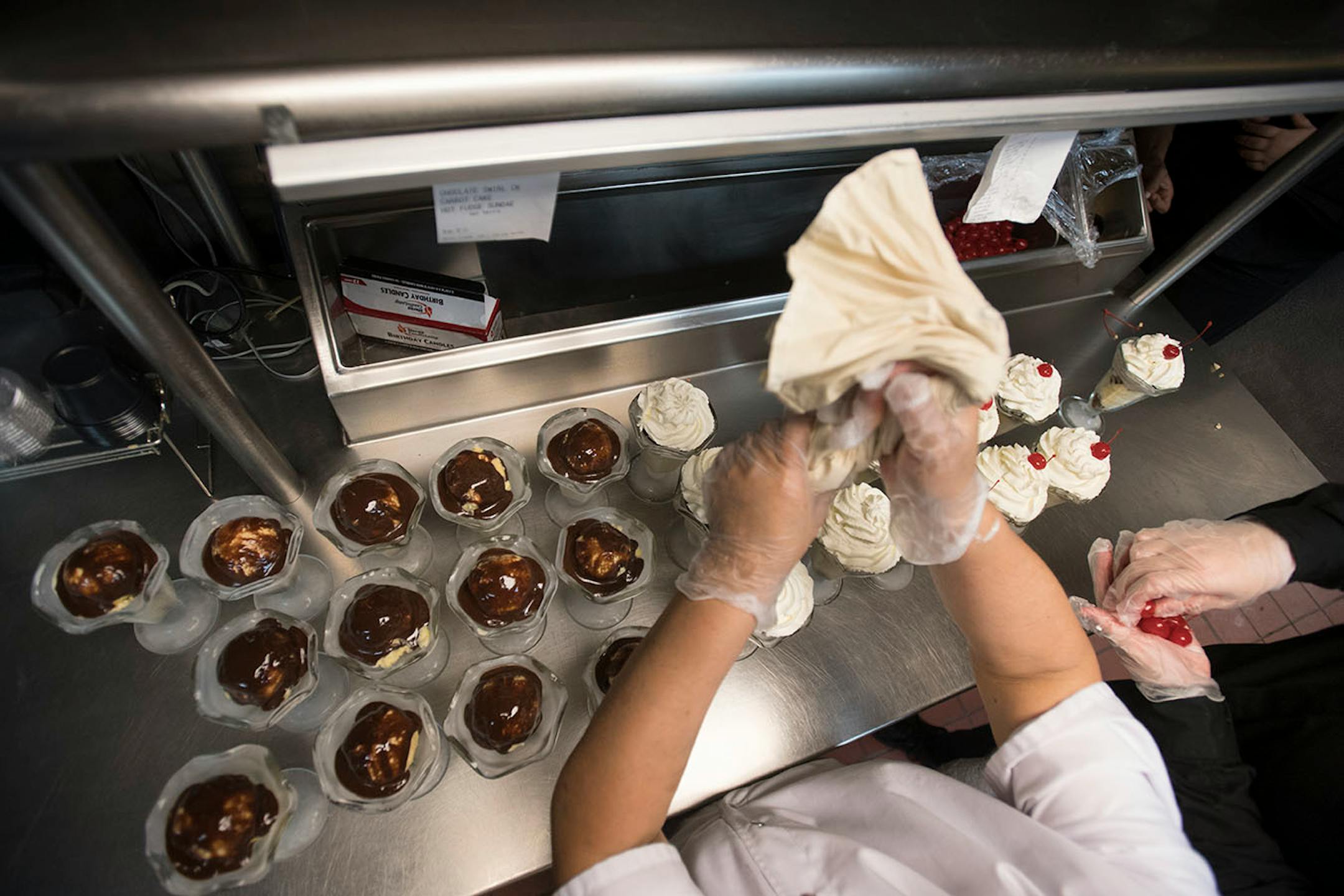 Sundae's were topped with chocolate, whipped cream and cherries before being brought out to tables during intermission.