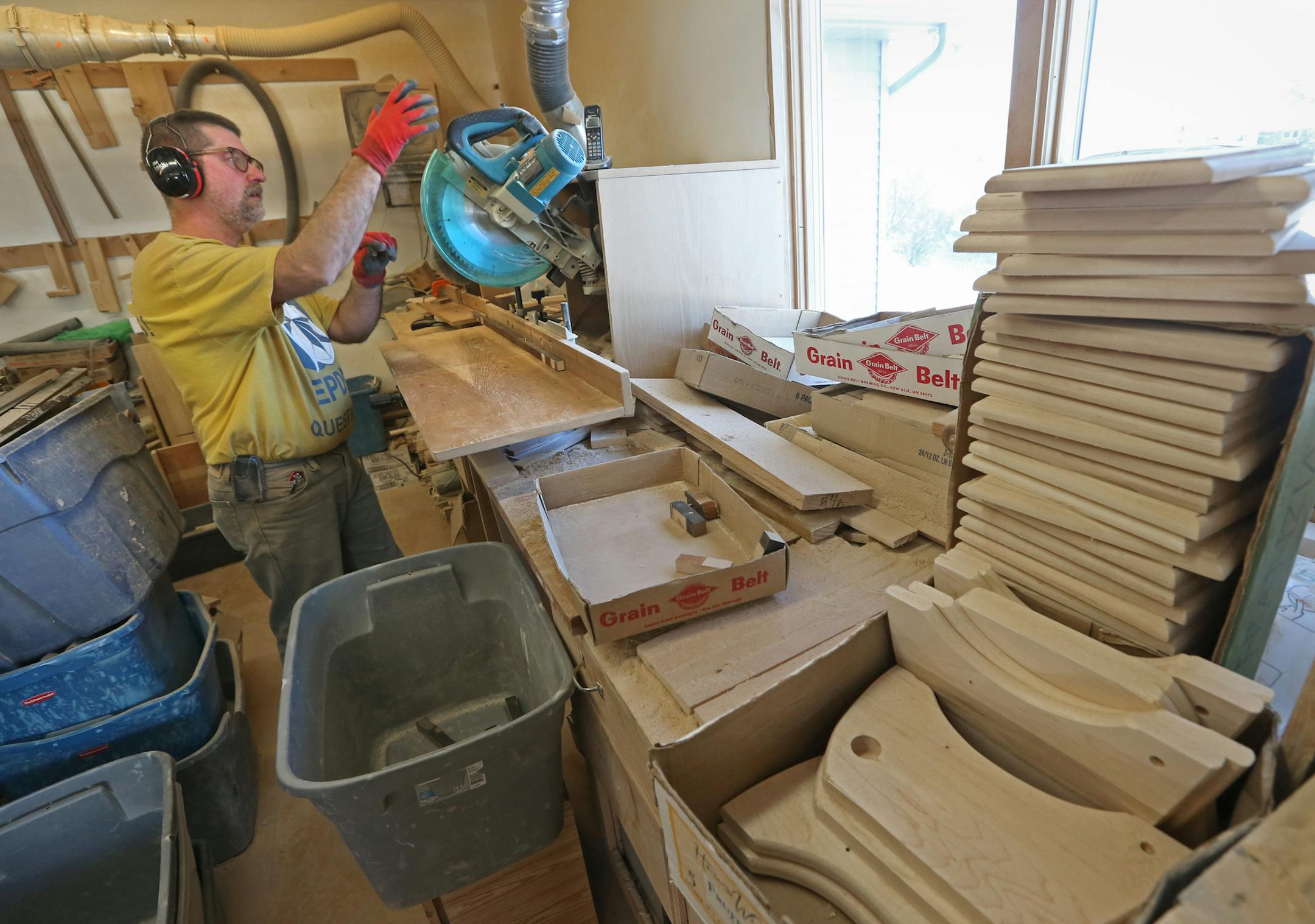 Volunteer Scott Cords cut wood at the workshop of TLC Toys, a nonprofit organization that crafts toys for kids around the country. They're in high gear at this time of the year. All the toys they make are from wood. Photographed on 12/10/13.] Bruce Bisping/Star Tribune bbisping@startribune.com Scott Cords/source.