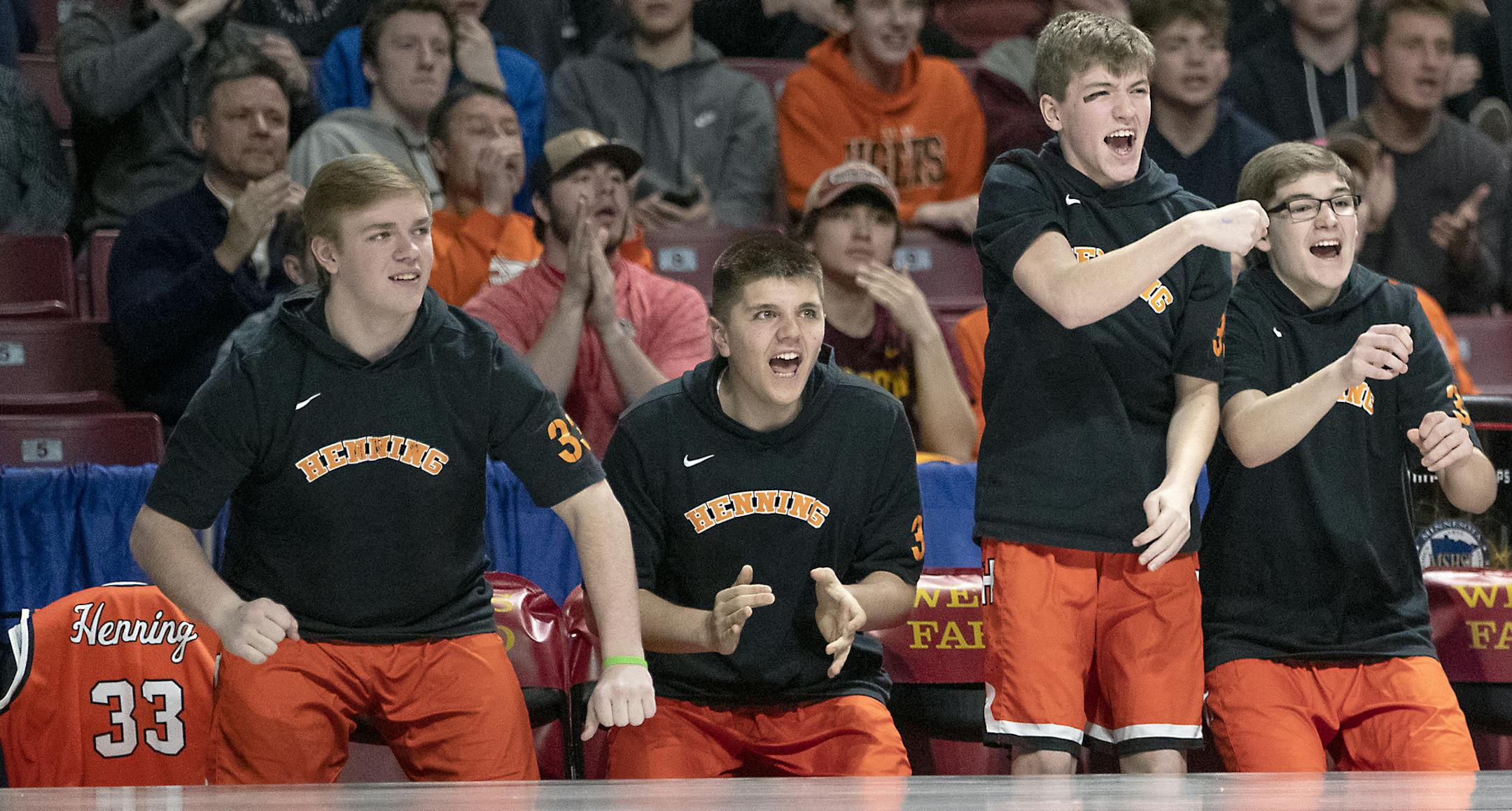 Henning's bench, with an empty chair holding the jersey of number 33, cheered on their team during the second period of their matchup in the boys' basketball state tournament 1A quarterfinals, Thursday, March 21, 2019 at Williams Arena in Minneapolis, MN. ] ELIZABETH FLORES • liz.flores@startribune.com