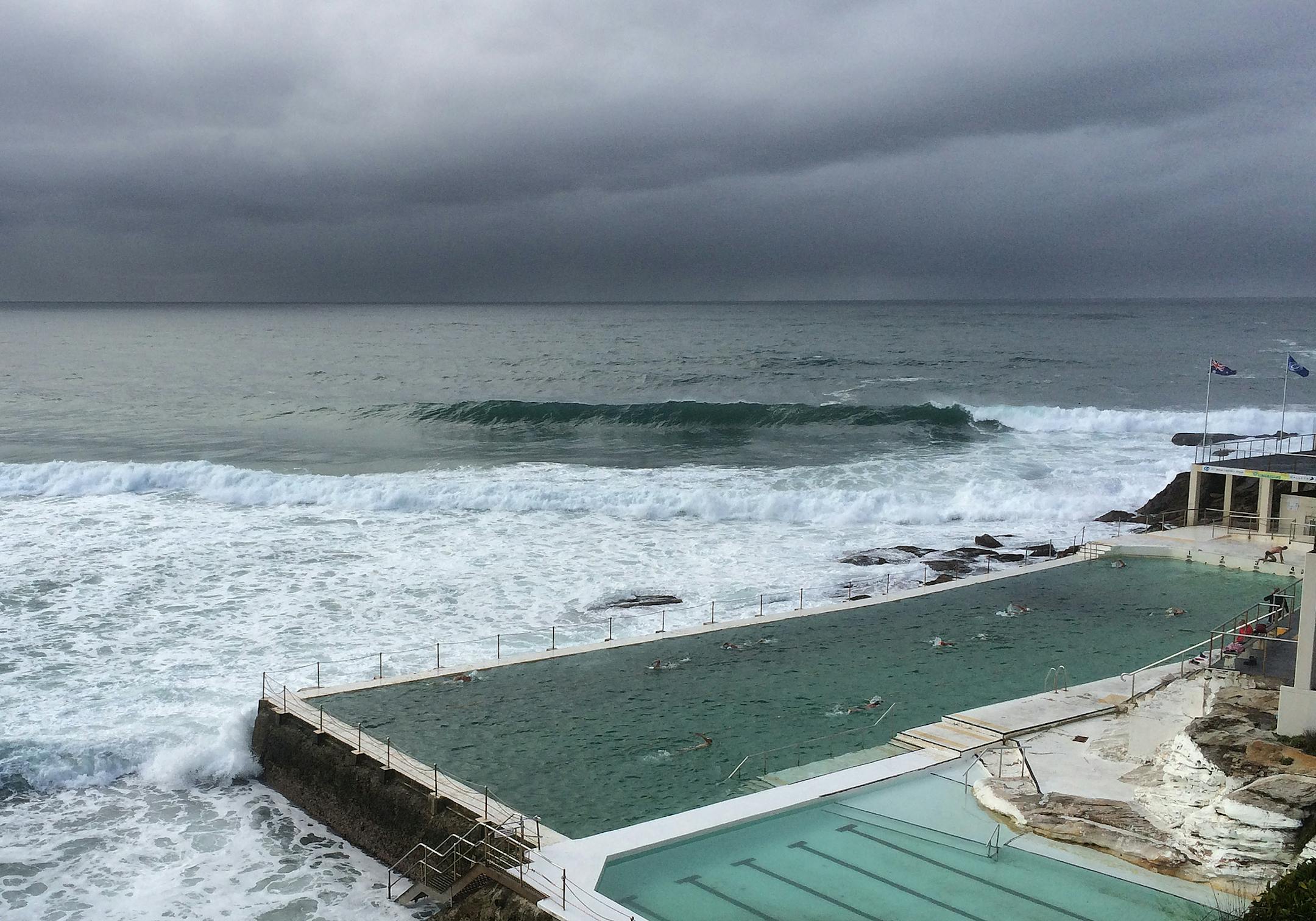 Pacific Ocean waves splash against the two outdoor pools at Icebergs.
