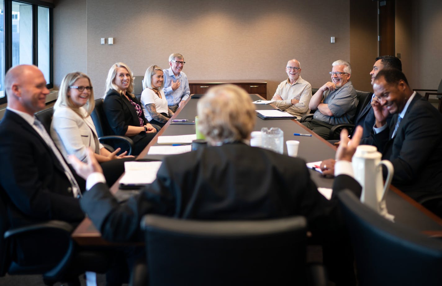 Judge Donovan Frank met with probation staff, prosecutors, federal defenders and mentors before they all begin the week's session of re-entry court. Clockwise around the table from Judge Frank are U.S probation officer Randy Nikula, assistant federal defender Shannon Elkins, DOJ reentry affairs coordinator Jamie Rigling, mentors Mindy Mueller, Chris Finseth, Kerry Kruppstadt, Rocky DeYoung, assistant U.S. attorney Allen Slaughter and U.S. probation officer Reggie Hall. ] GLEN STUBBE &#xef; glen.