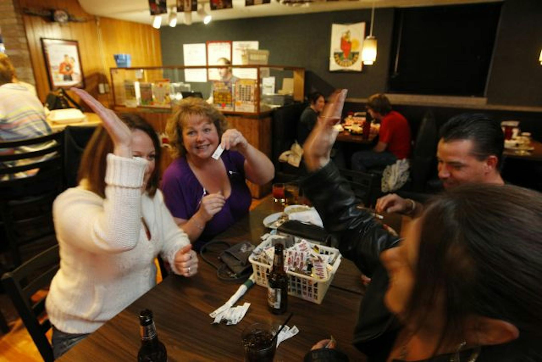 A winner! Deb Wolke — not to be confused with co-owner and sister-in-law Debbie Wolke — won $599 playing pulltabs. Joining her were Nancy Barlow (left) and Joe and Leasa Schreiber.