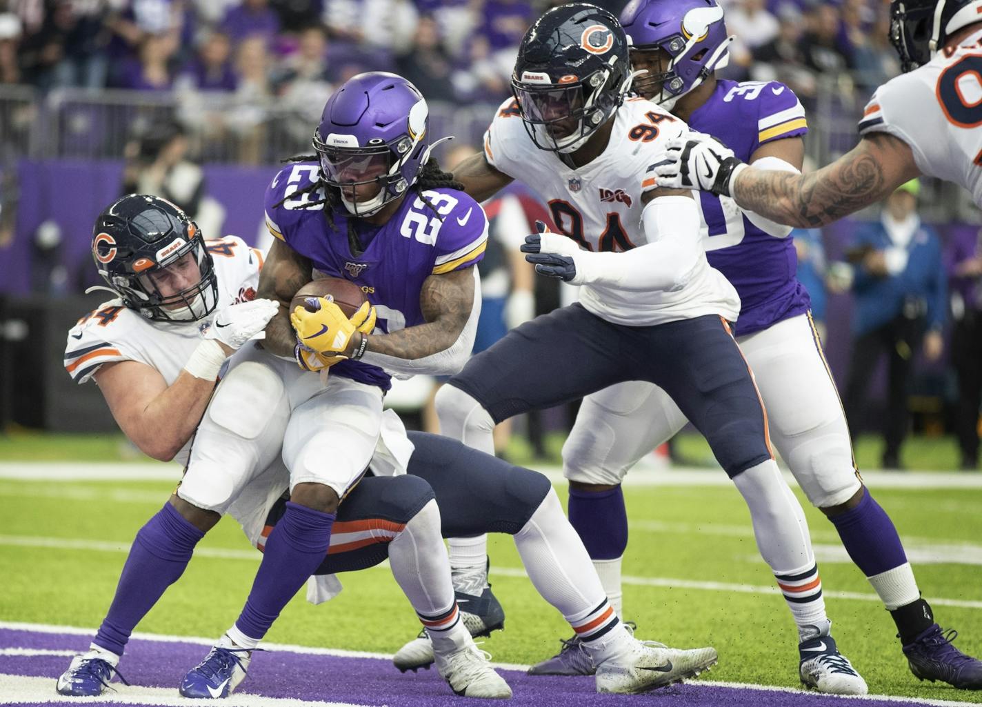 Minnesota Vikings running back Mike Boone (23) was tackled in the end zone for a safety by Chicago Bears inside linebacker Nick Kwiatkoski (44) in the second quarter.