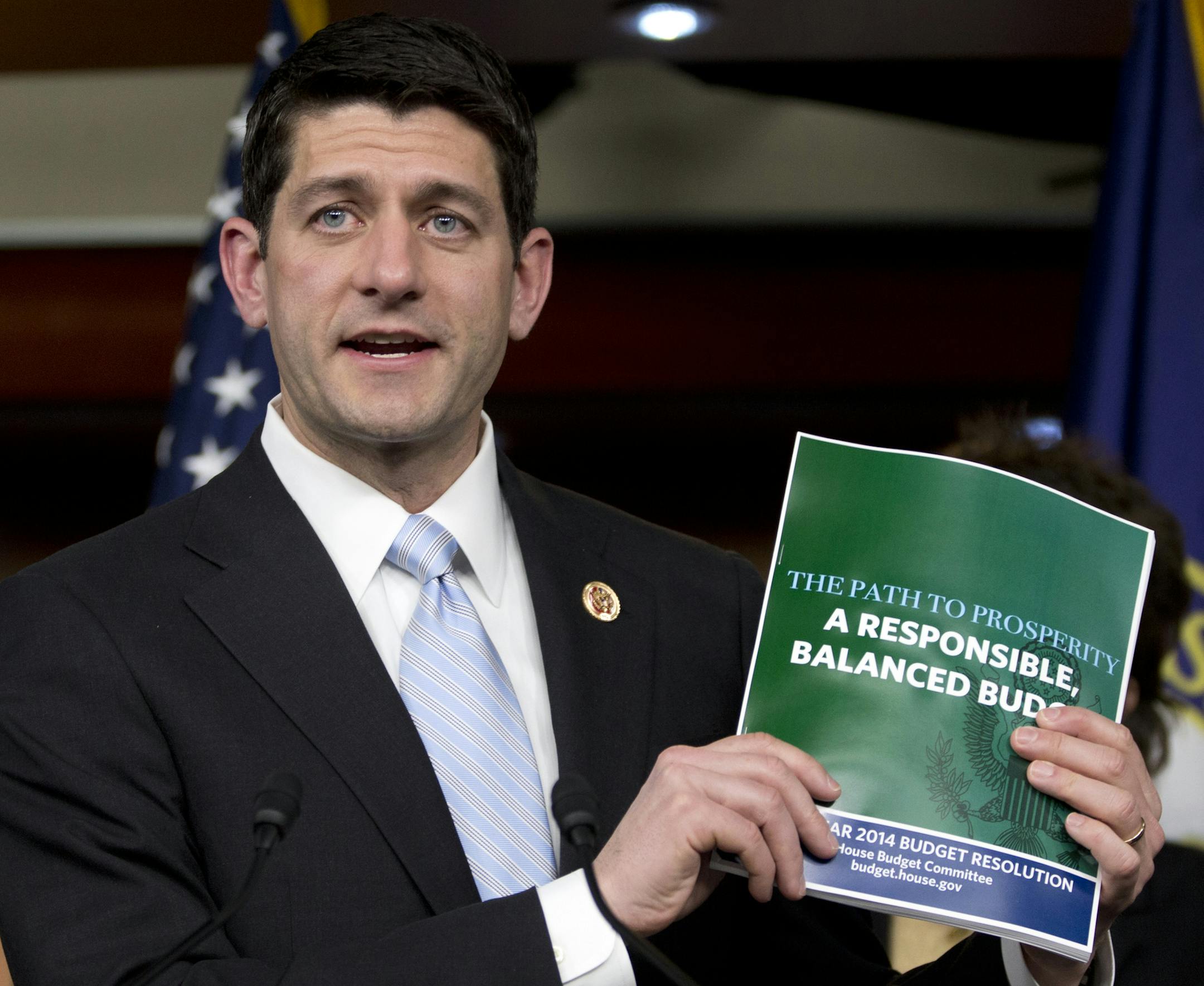 House Budget Committee Chairman Rep. Paul Ryan, R-Wis., holds up a copy of the House Budget Committee 2014 Budget Resolution as he speaks during a news conference on Capitol Hill in Washington, Tuesday, March 12, 2013. (AP Photo/Carolyn Kaster)