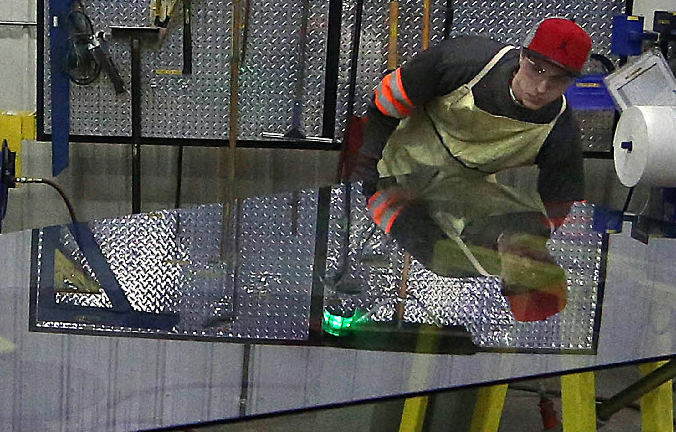 Viracon worker Matt Smith prepared a panel of glass for shipping the installer for construction of the new Vikings Stadium. ] JIM GEHRZ Ô james.gehrz@startribune.com / Owatonna, MN / February 12, 2015 /11:00 AM - BACKGROUND INFORMATION: Glass maker Viracon begins producing the windows for the new Vikings Stadium in February. We have been invited in for a tour. The company CEO will see some of the first windows roll off the production line. The plant is in Owatonna. ORG XMIT: MIN150221171319